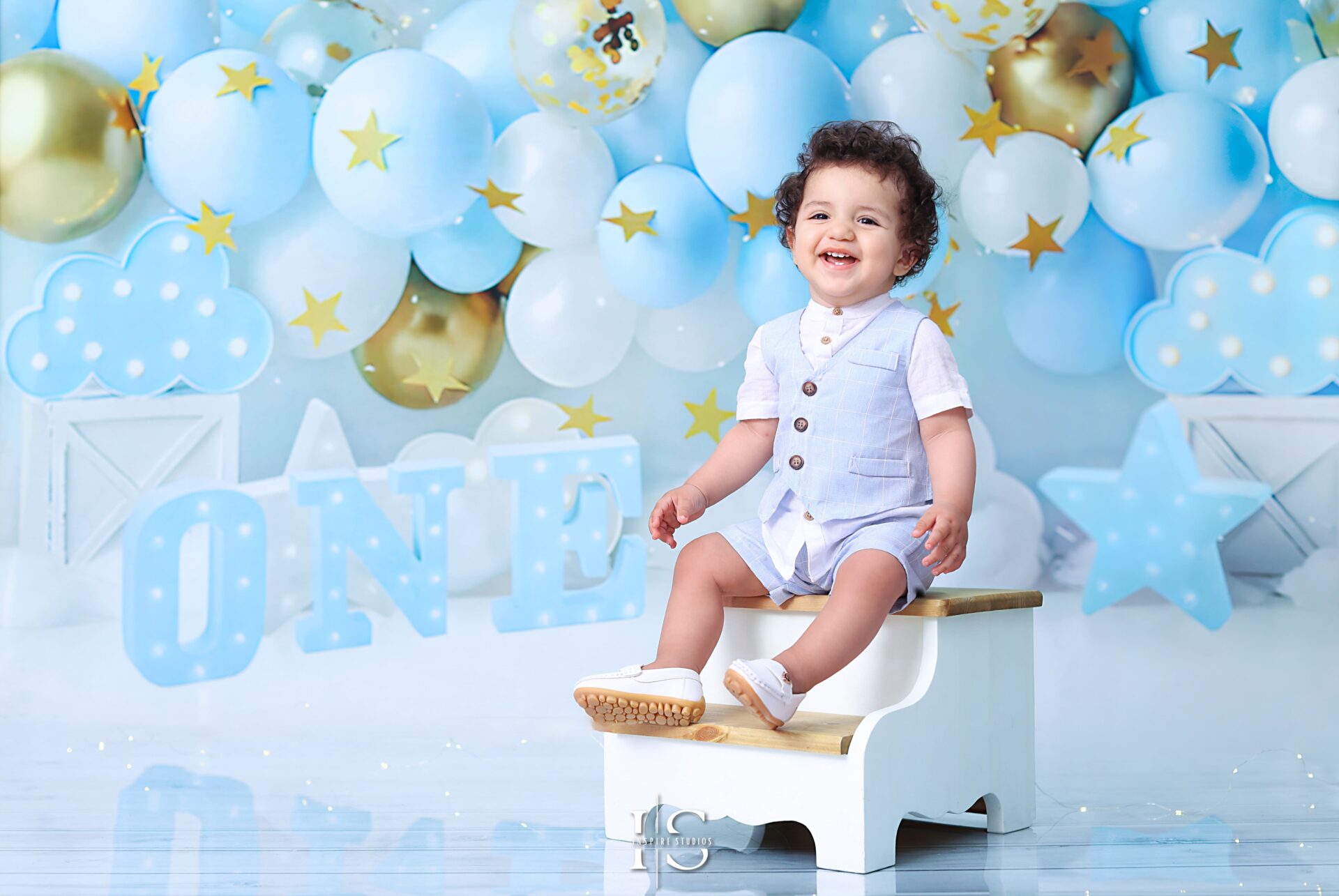 Baby boys enjoying a first birthday photoshoot in London studio