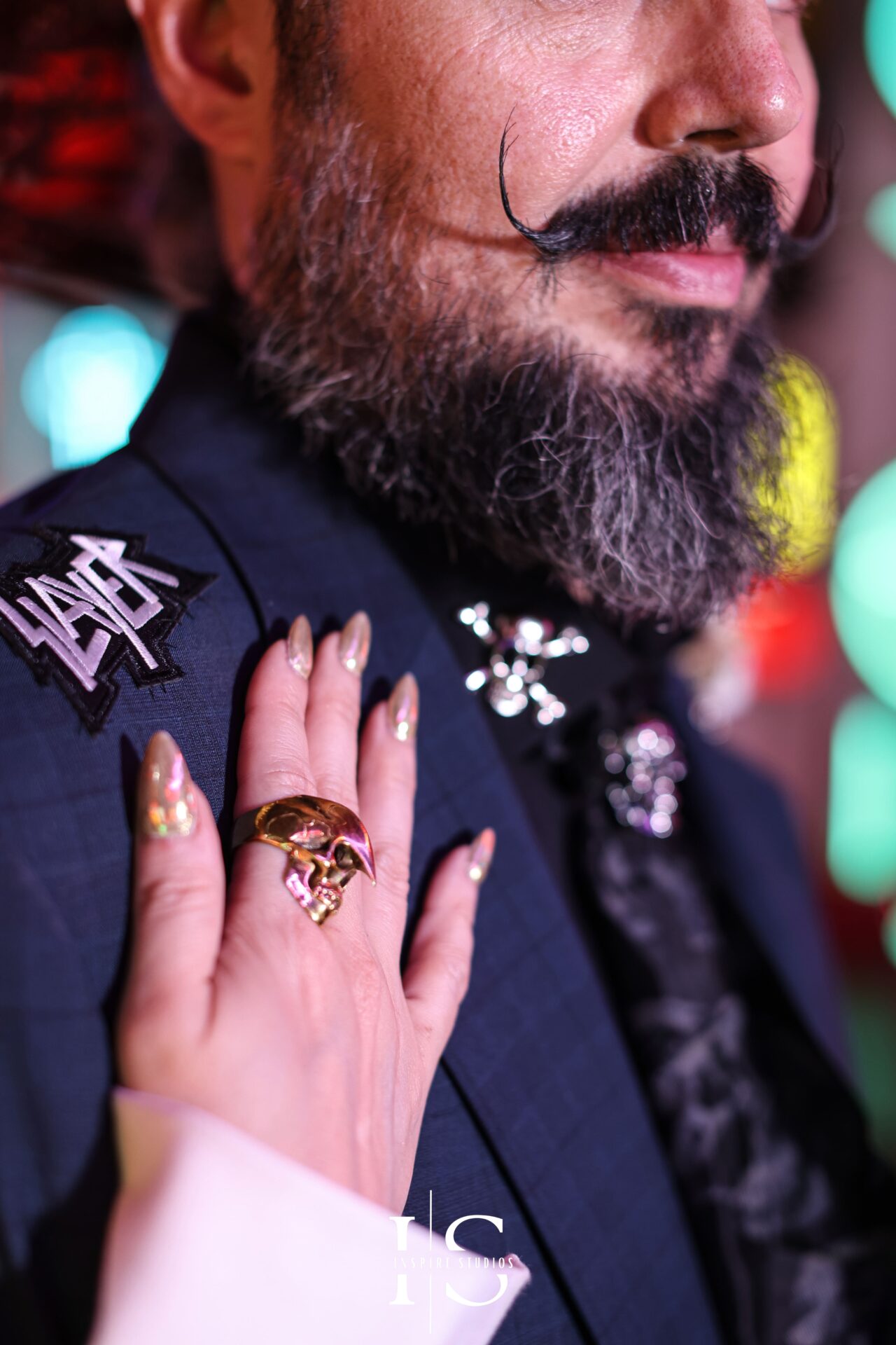 Bride’s hand resting on groom’s shoulder close-up at Gods Own Junkyard wedding