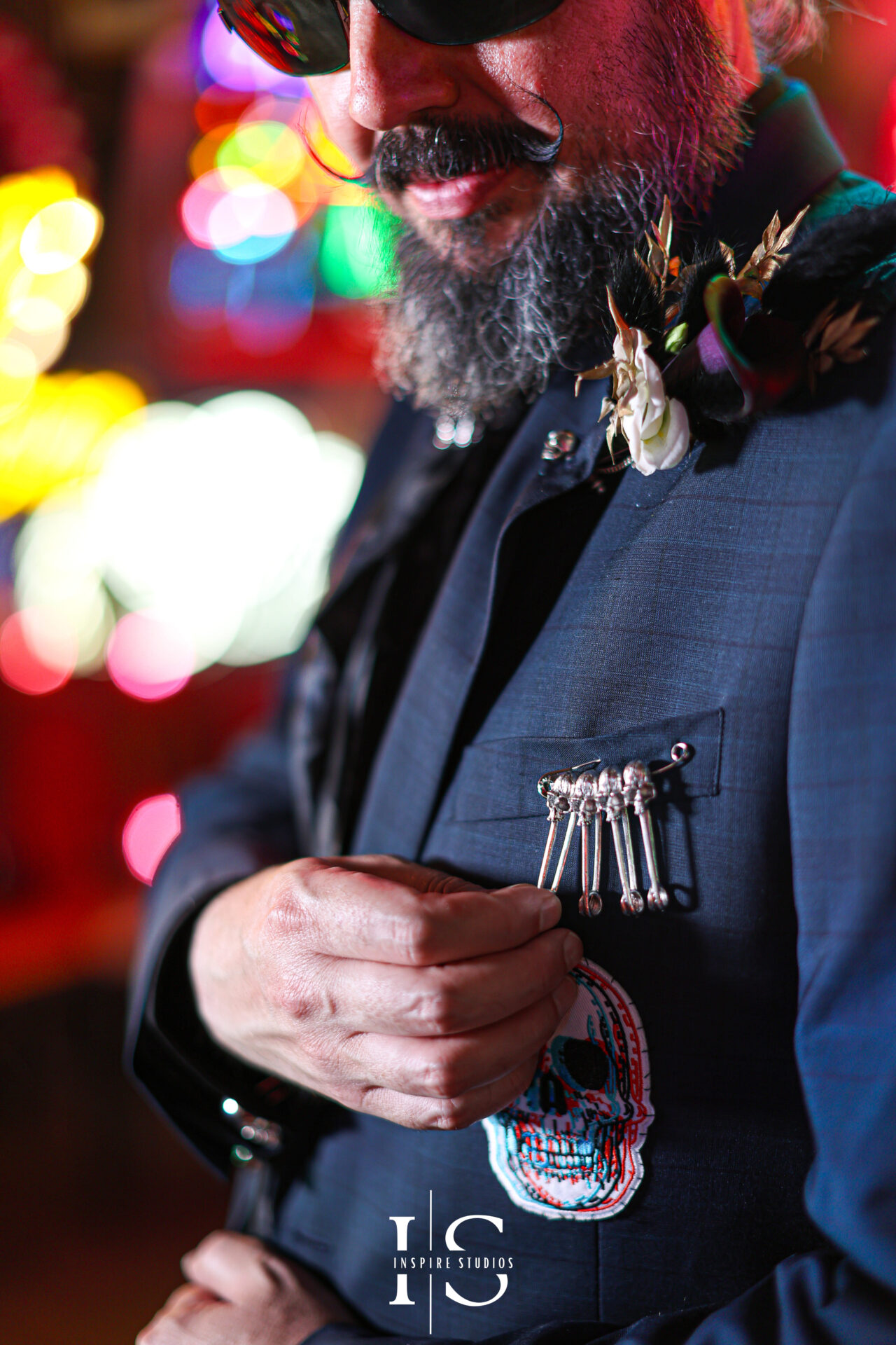 Groom close-up preparation photos at punk wedding venue Gods Own Junkyard