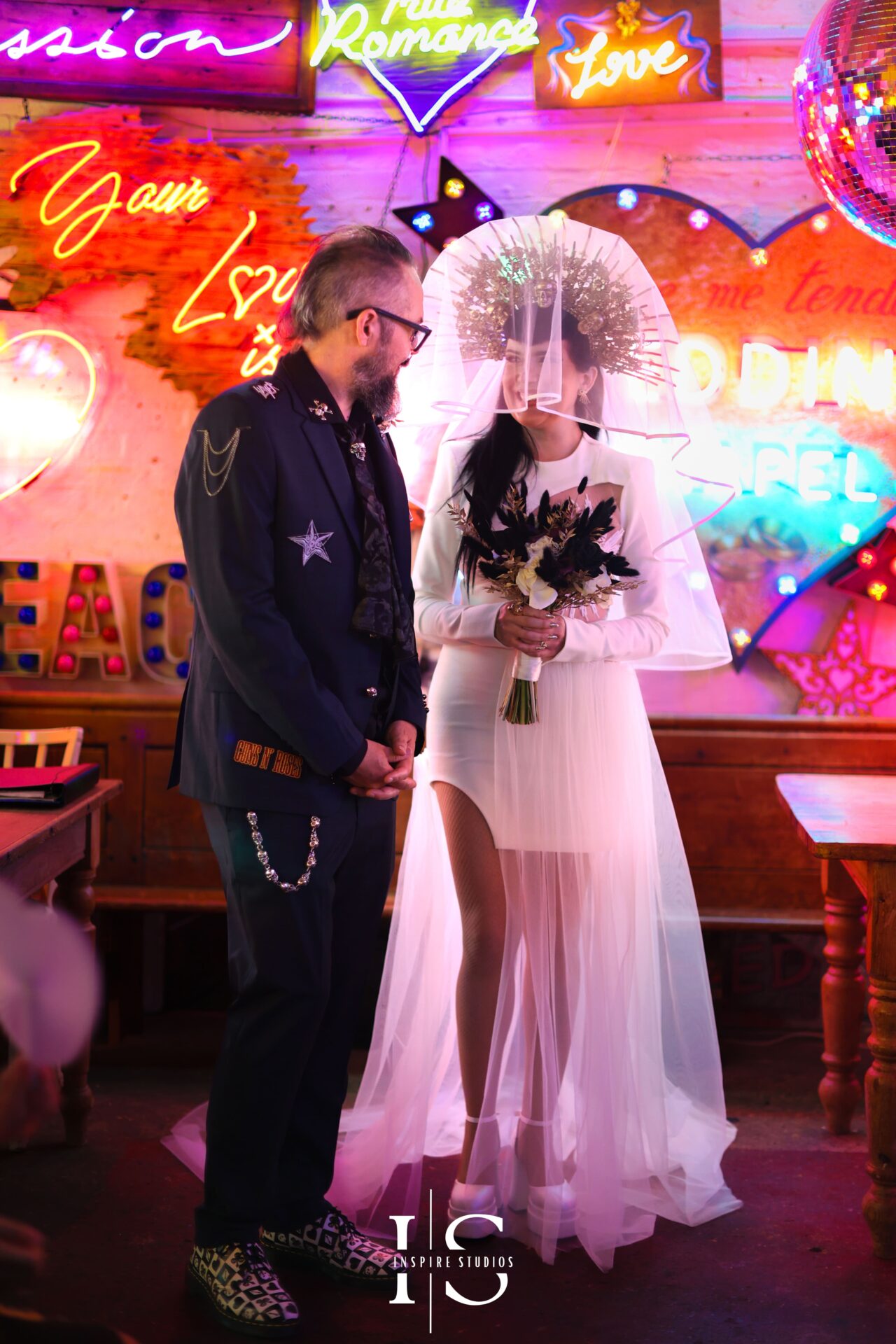 Bride and groom exchanging vows at Gods Own Junkyard wedding ceremony