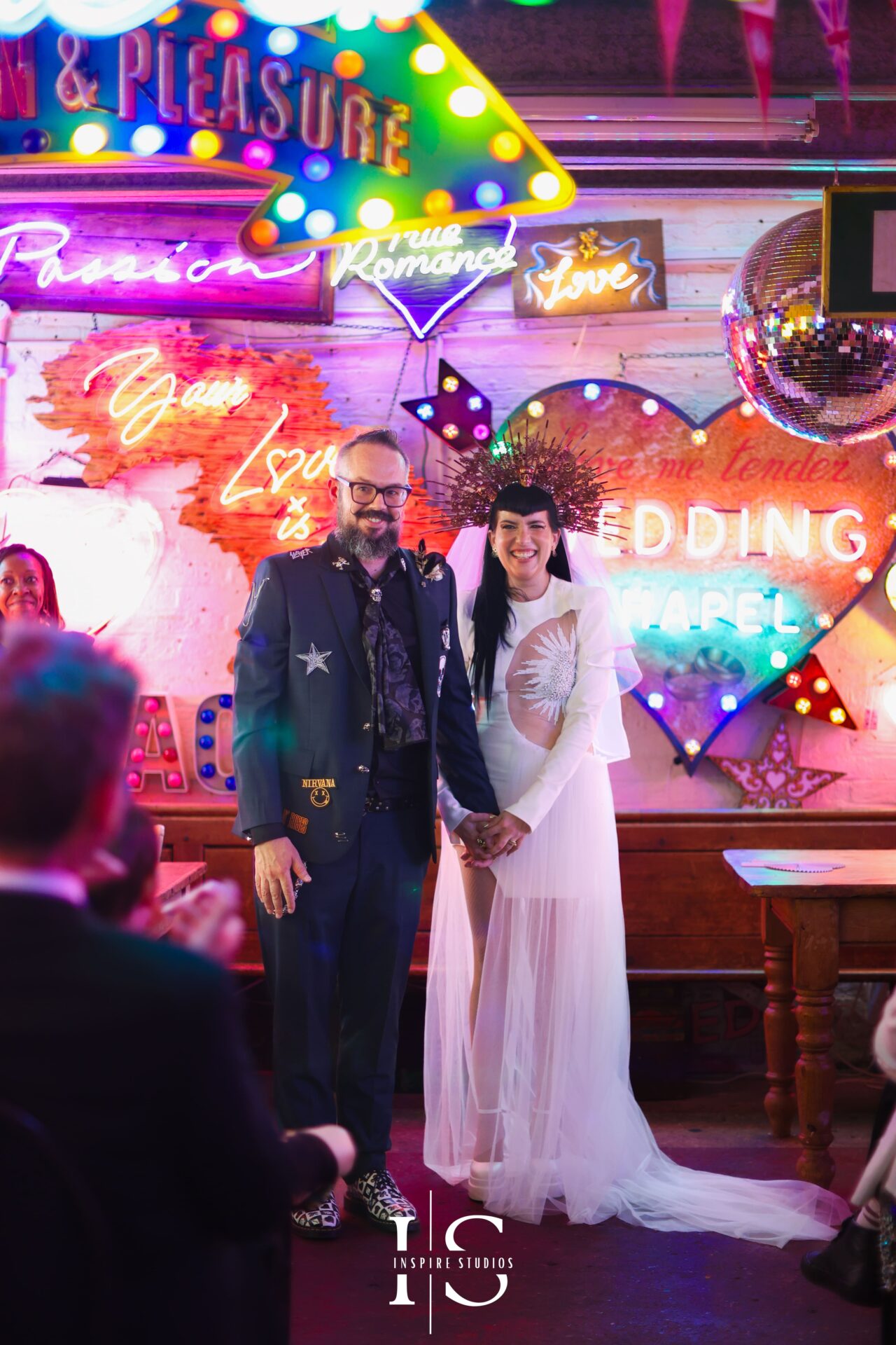 Newly married bride and groom celebrating at Gods Own Junkyard wedding venue