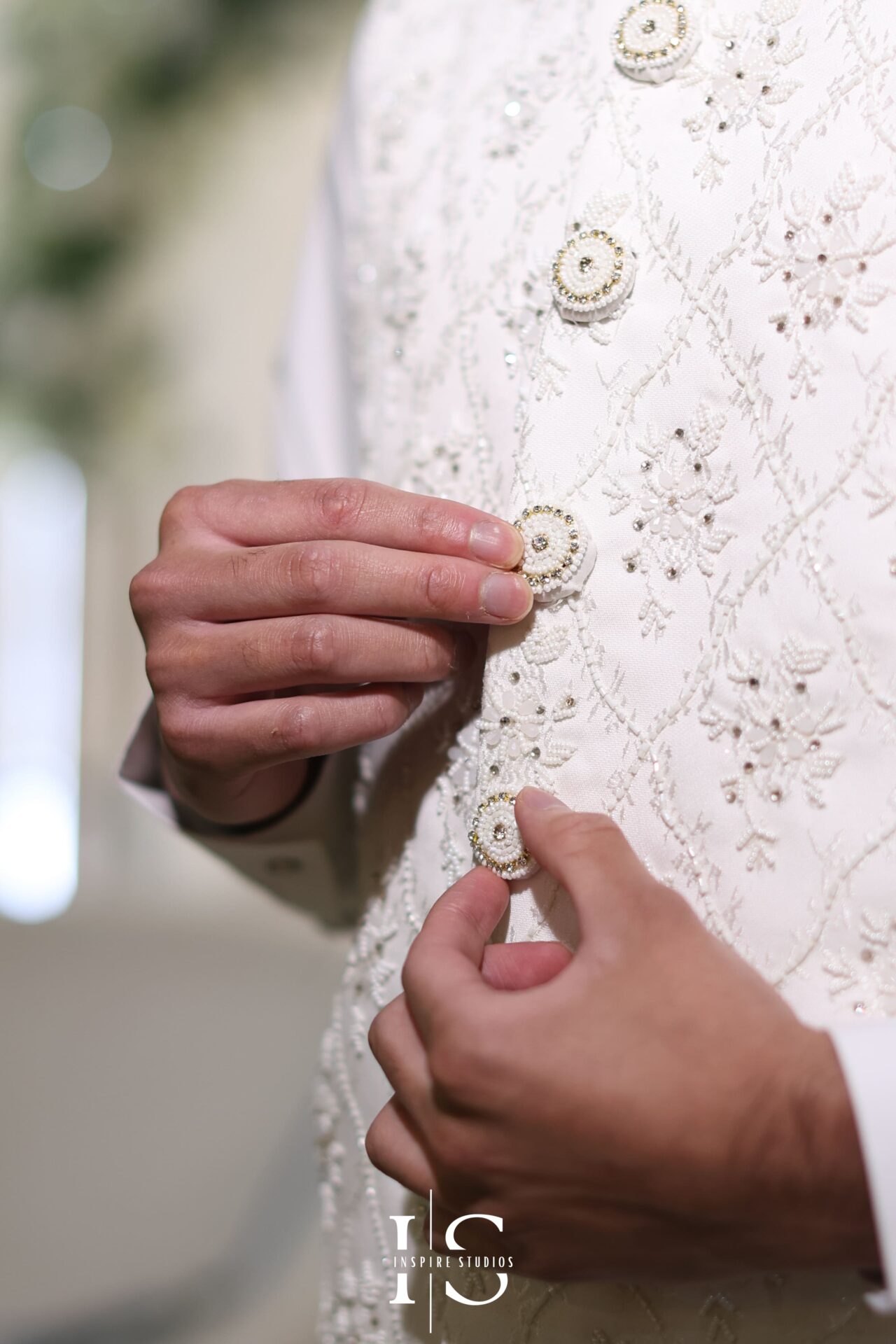 Groom getting ready for Nikkah – close-up of traditional attire Ilford