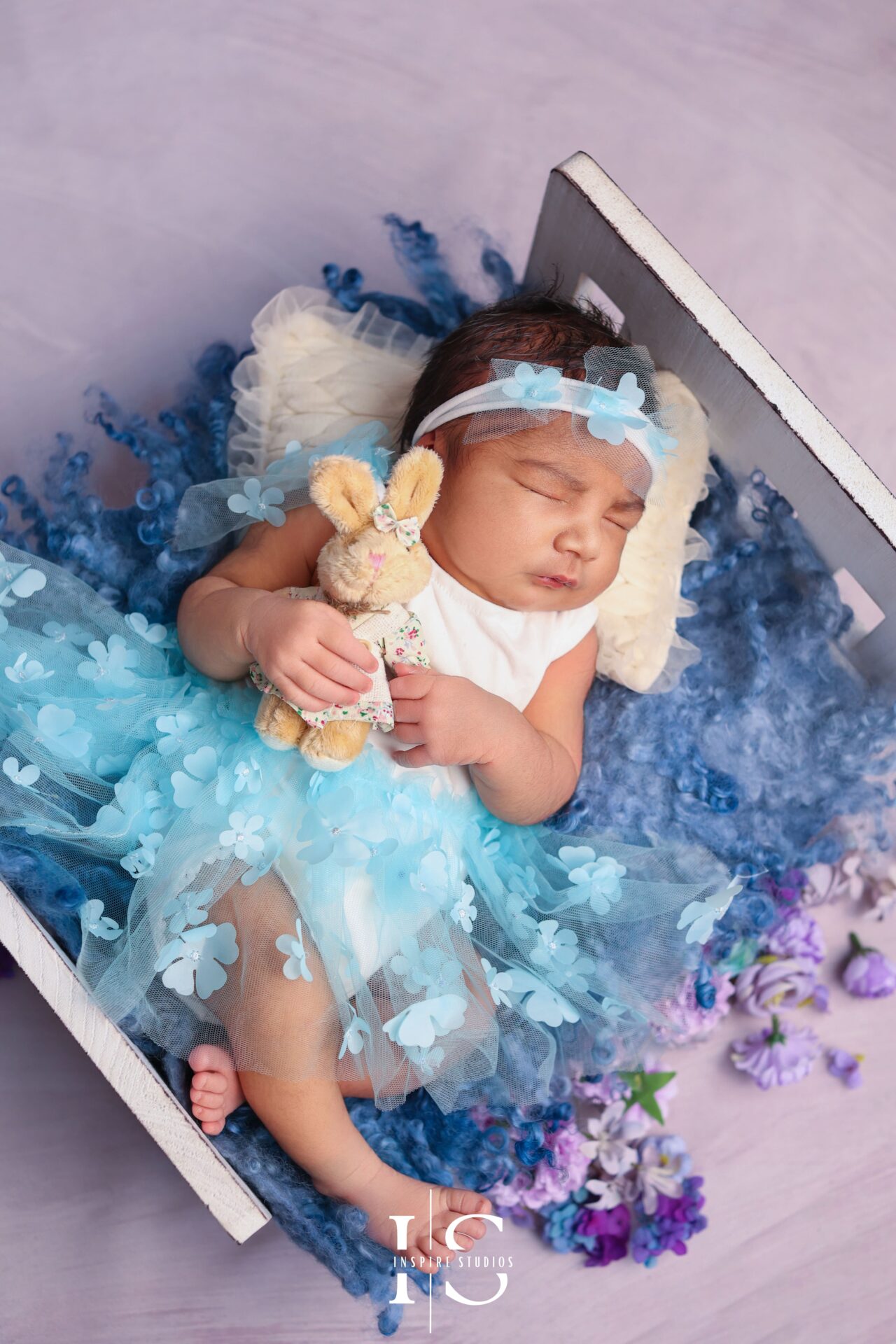 London studio newborn baby girl photoshoot with delicate pink tones.