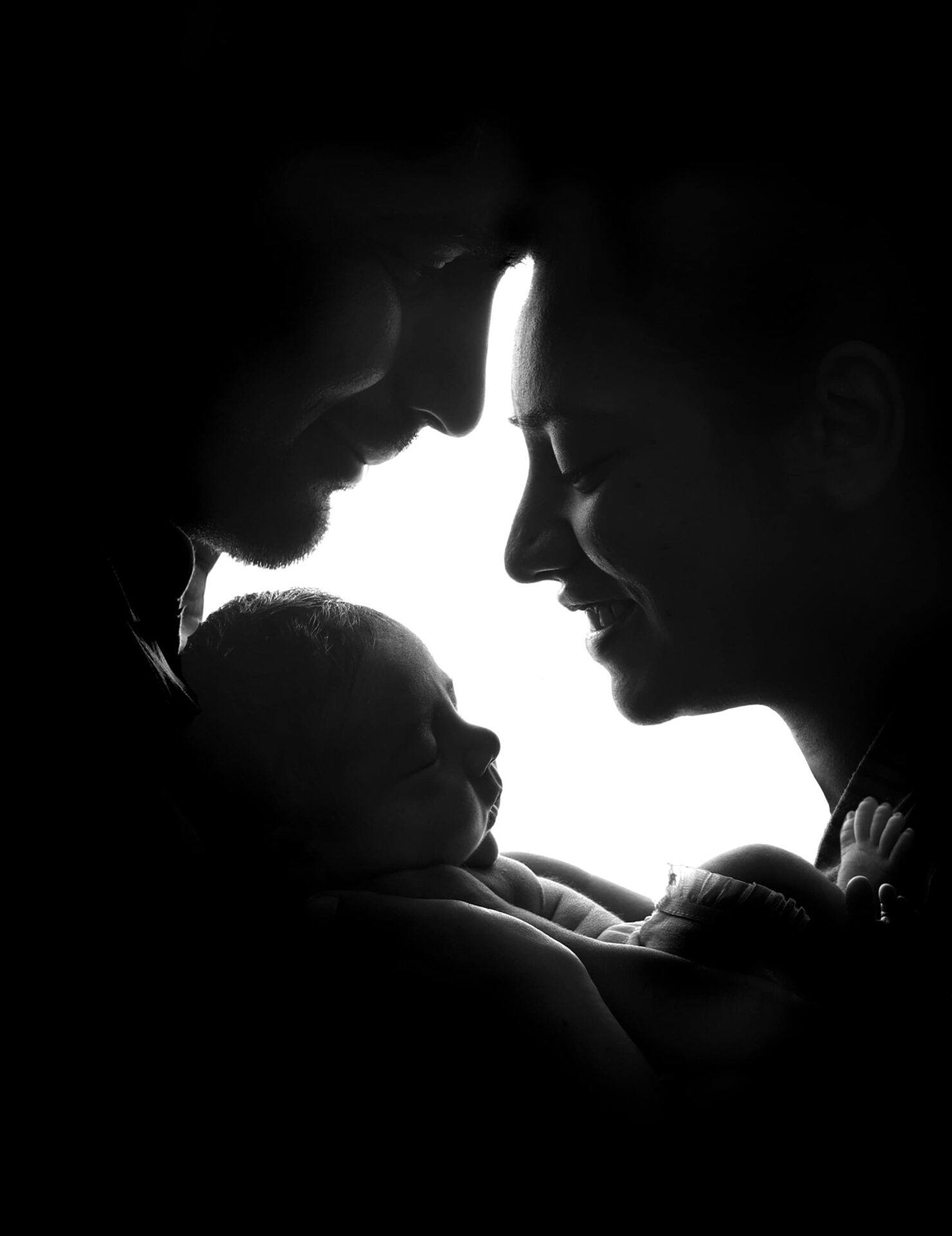 Newborn family photo in London studio captured by professional photographer