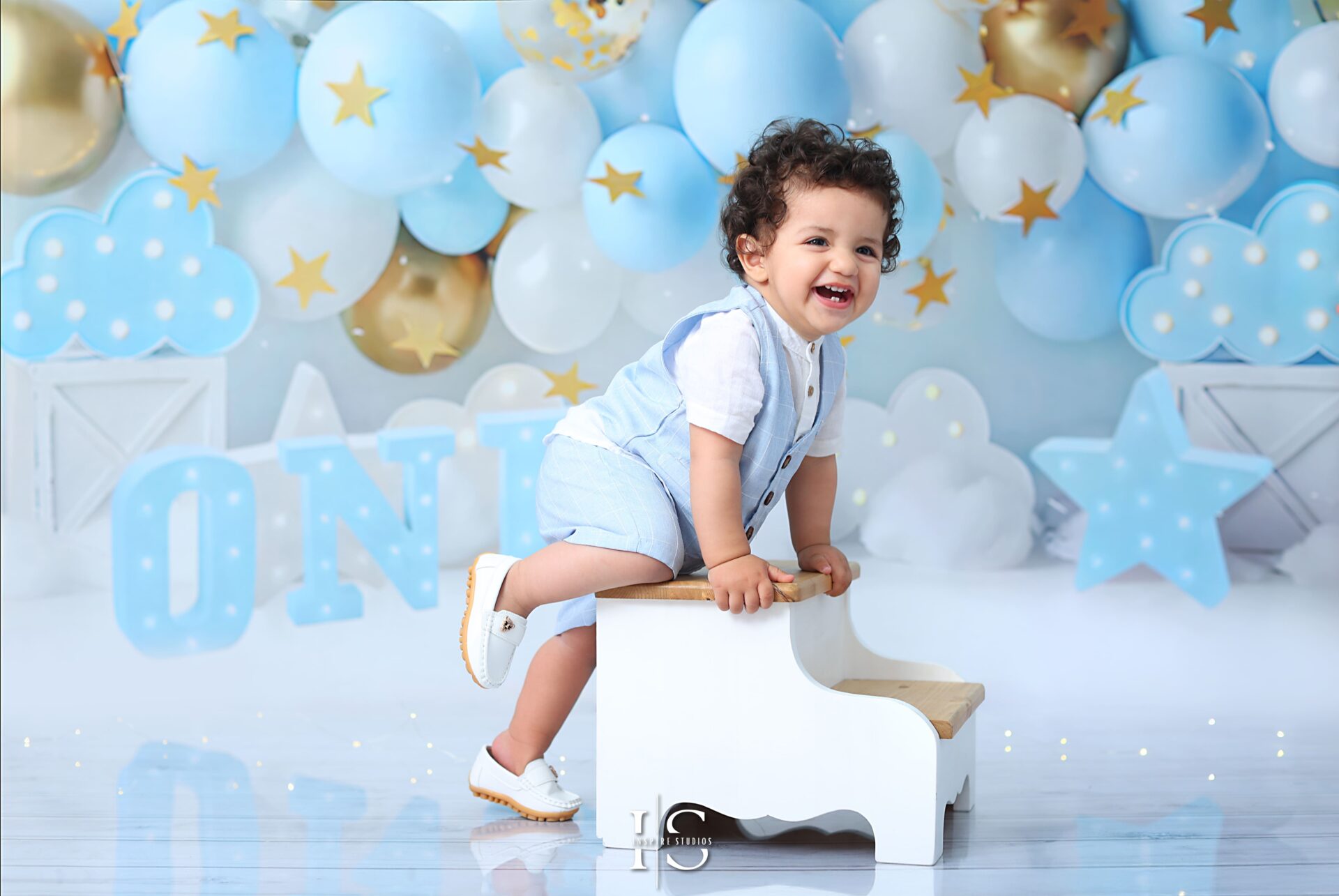 Baby boy during his one-year birthday photoshoot in London studio
