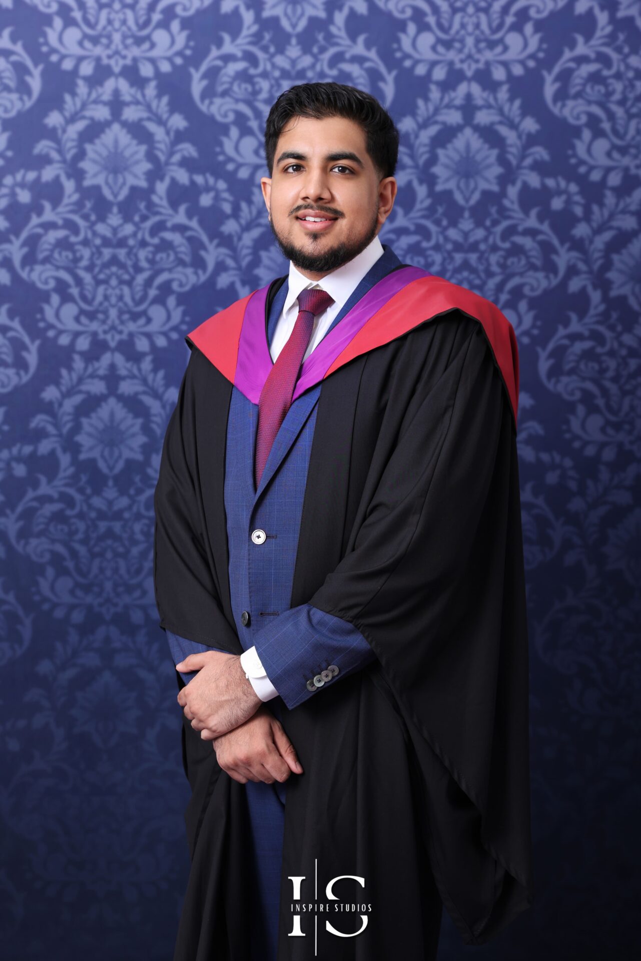 Graduate in cap and gown during a professional university graduation photoshoot