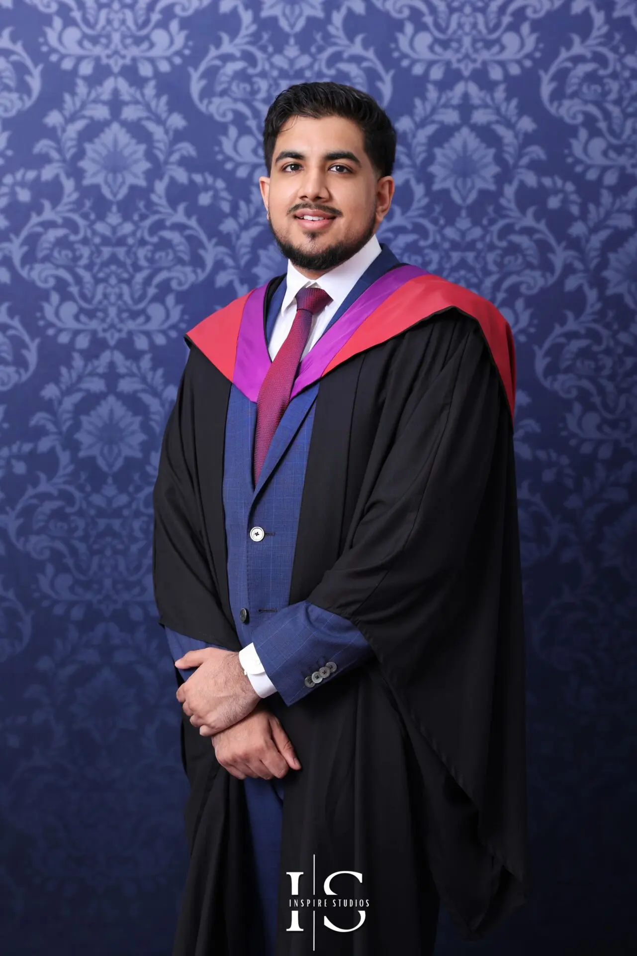 Graduate in cap and gown during a professional university graduation photoshoot