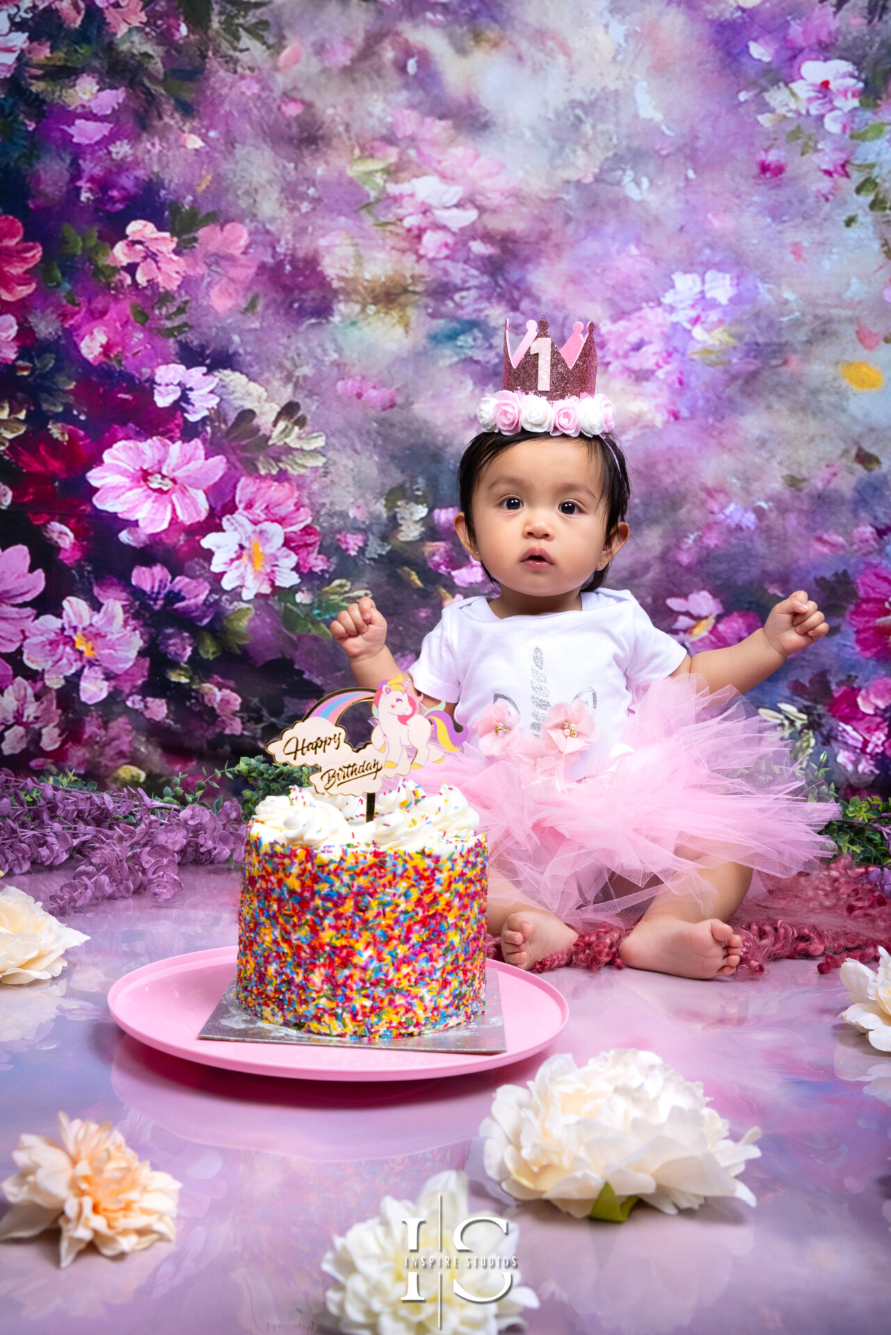 Studio photoshoot for a toddler’s first birthday celebration