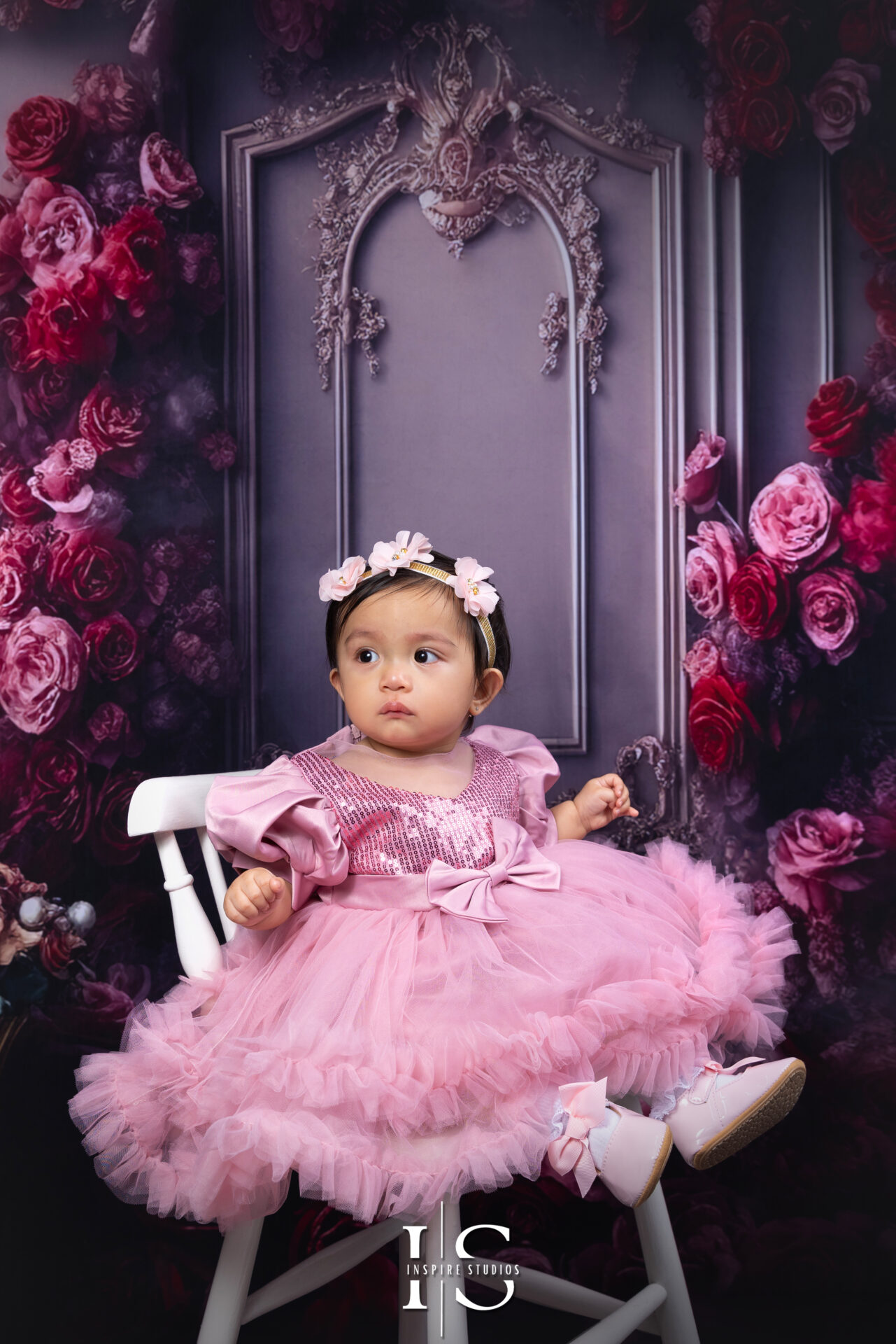Smash the cake session for a little girl during a studio photoshoot