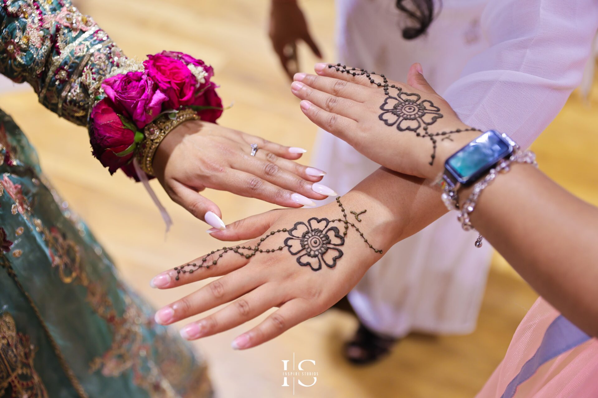 Bangladeshi Mehndi bride with friends at London wedding.