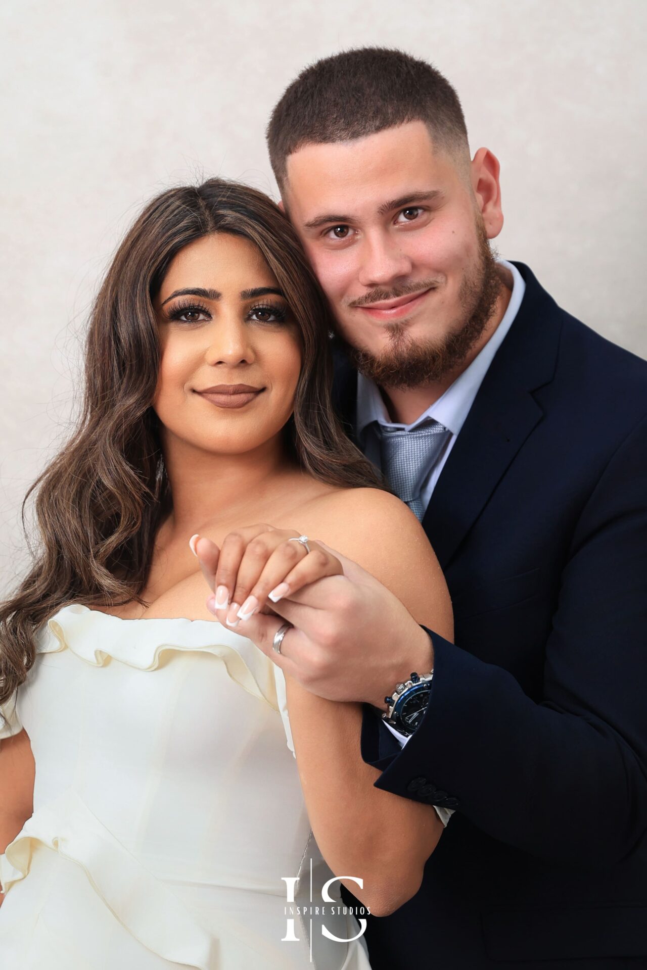 Vintage couple photoshoot in studio setting with classic style.