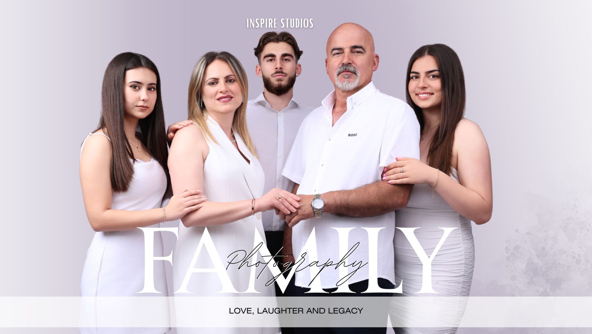 Happy family posing together in studio