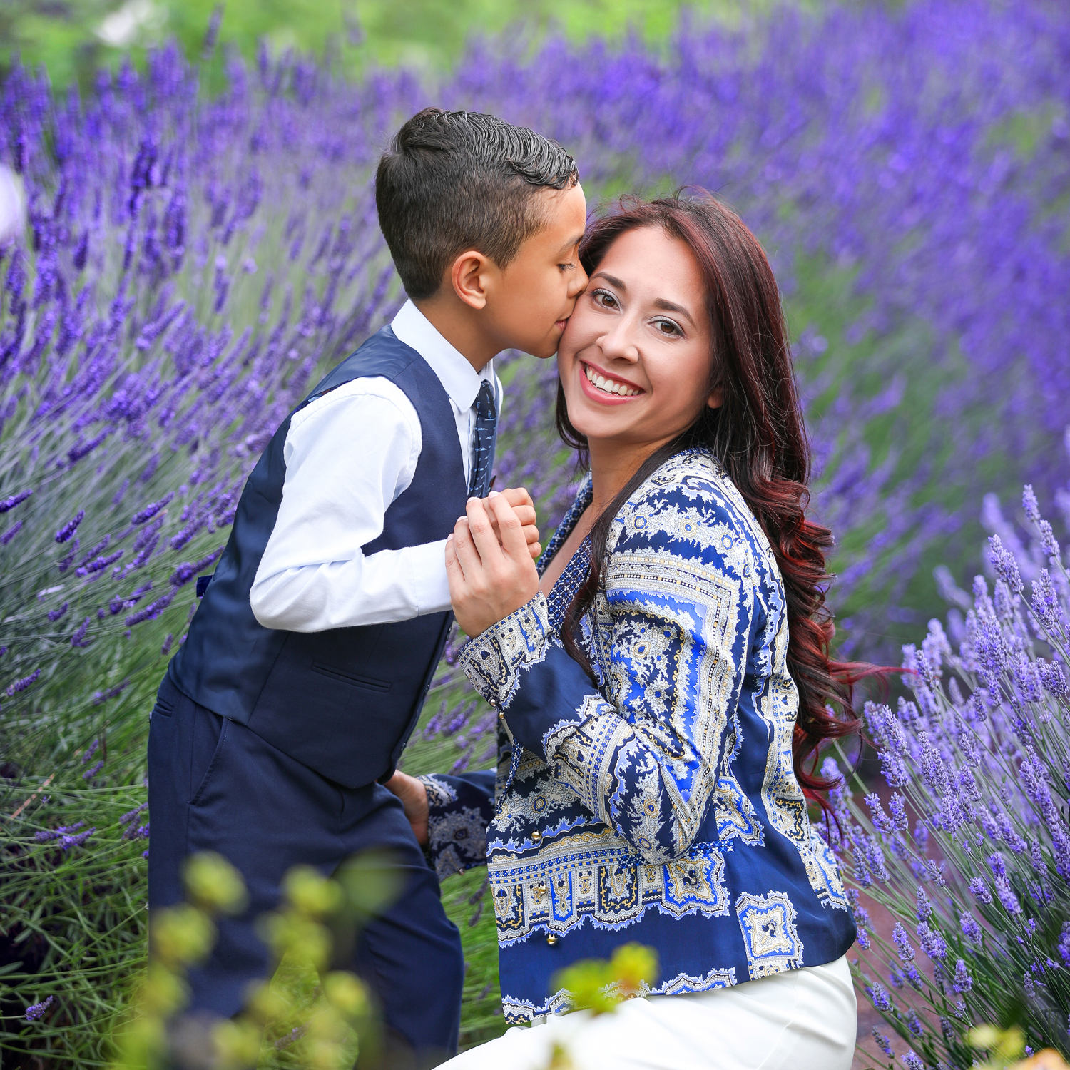 Family enjoying a fun outdoor photoshoot in London’s park with natural smiles and playful poses.