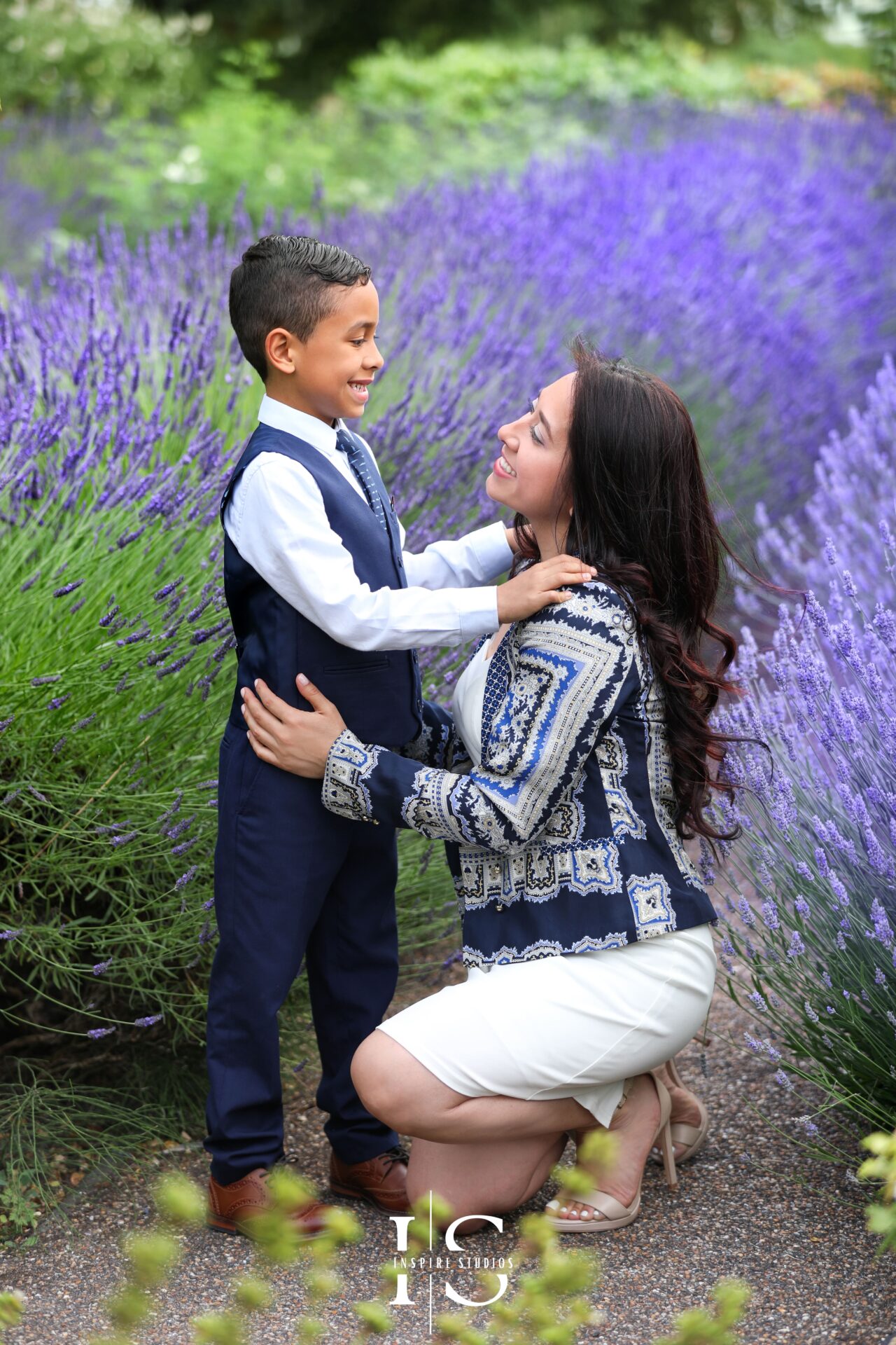 Family enjoying a photoshoot at Valentines Park, London, with playful poses and smiles.