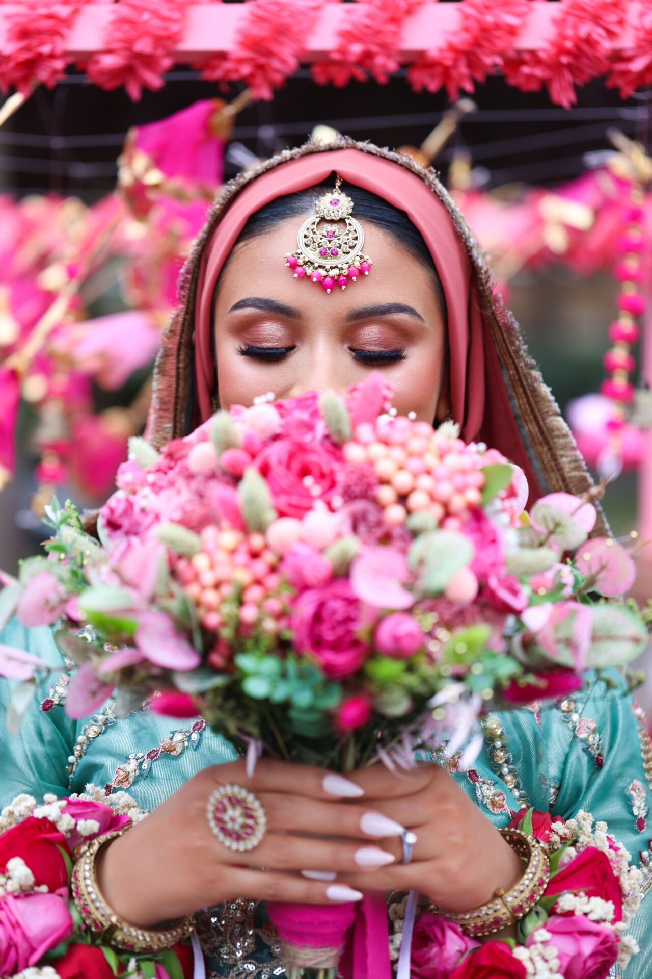 Female wedding photographer capturing a vibrant Bangladeshi Mehndi ceremony in London
