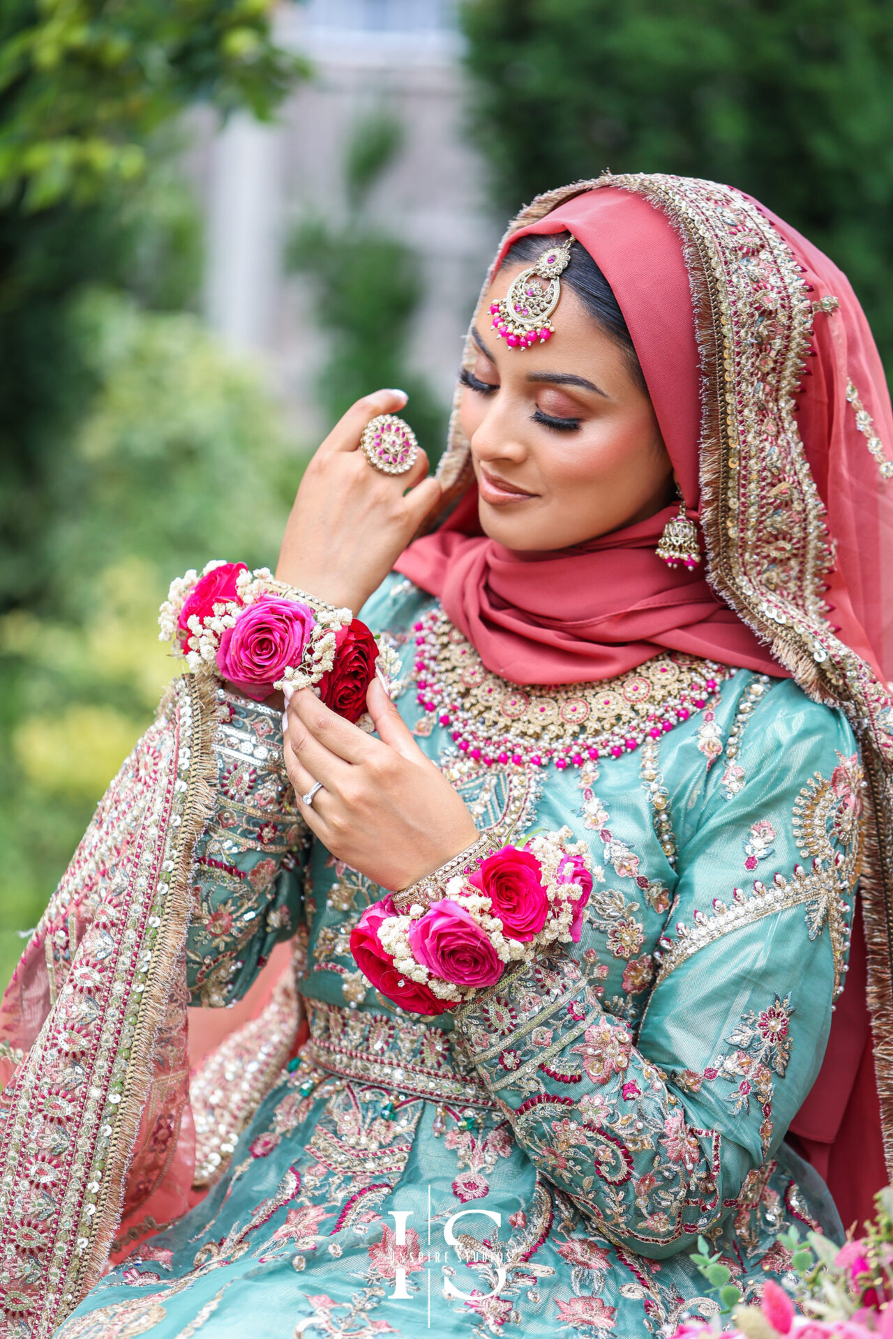 Female wedding photographer takes portraits of Mehndi bride in London.