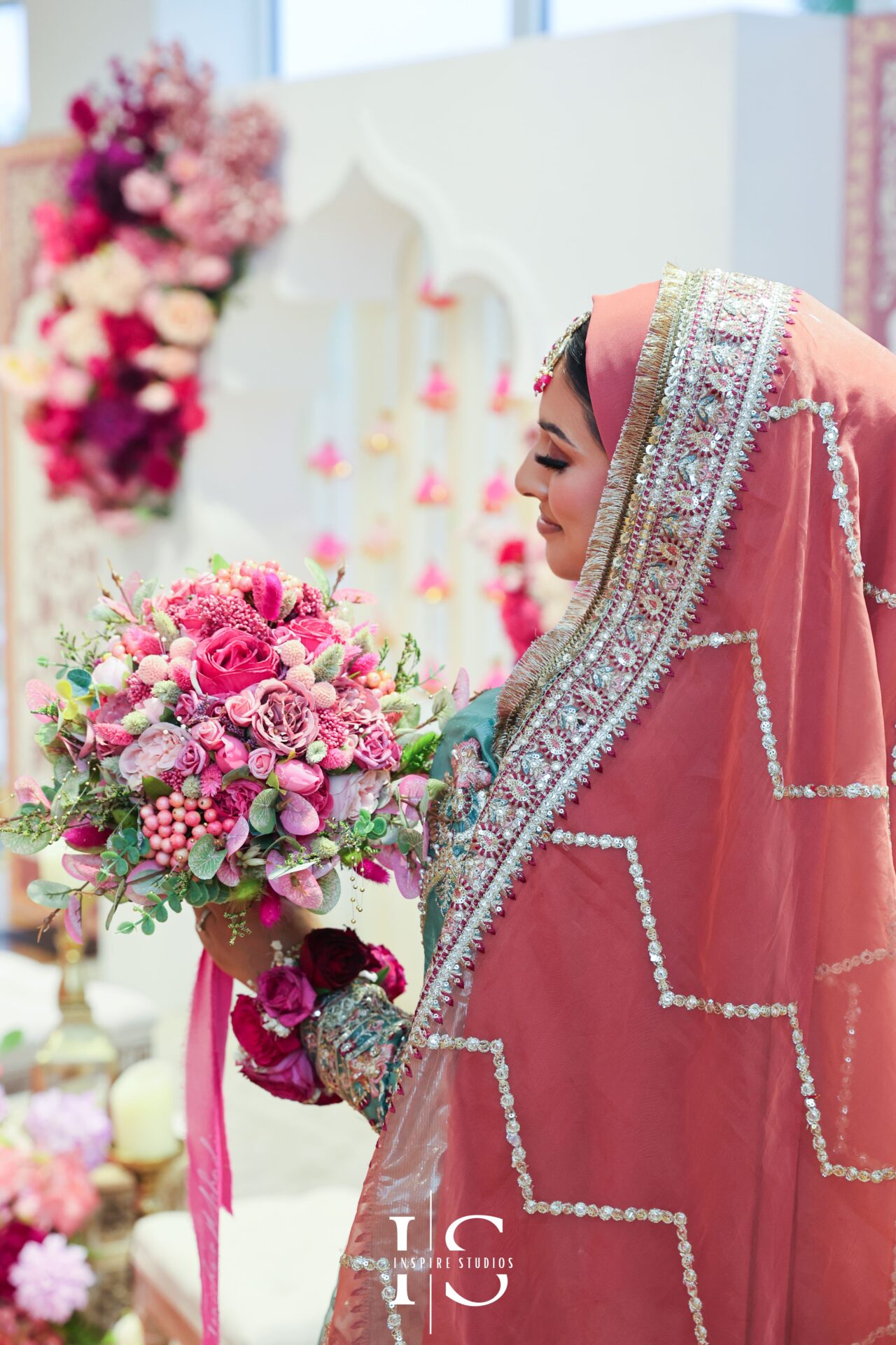 Female photographer from Inspire Studios capturing Mehndi wedding.