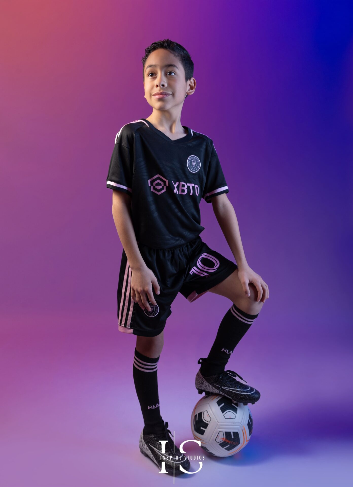 Creative kids sports studio photoshoot London with football theme