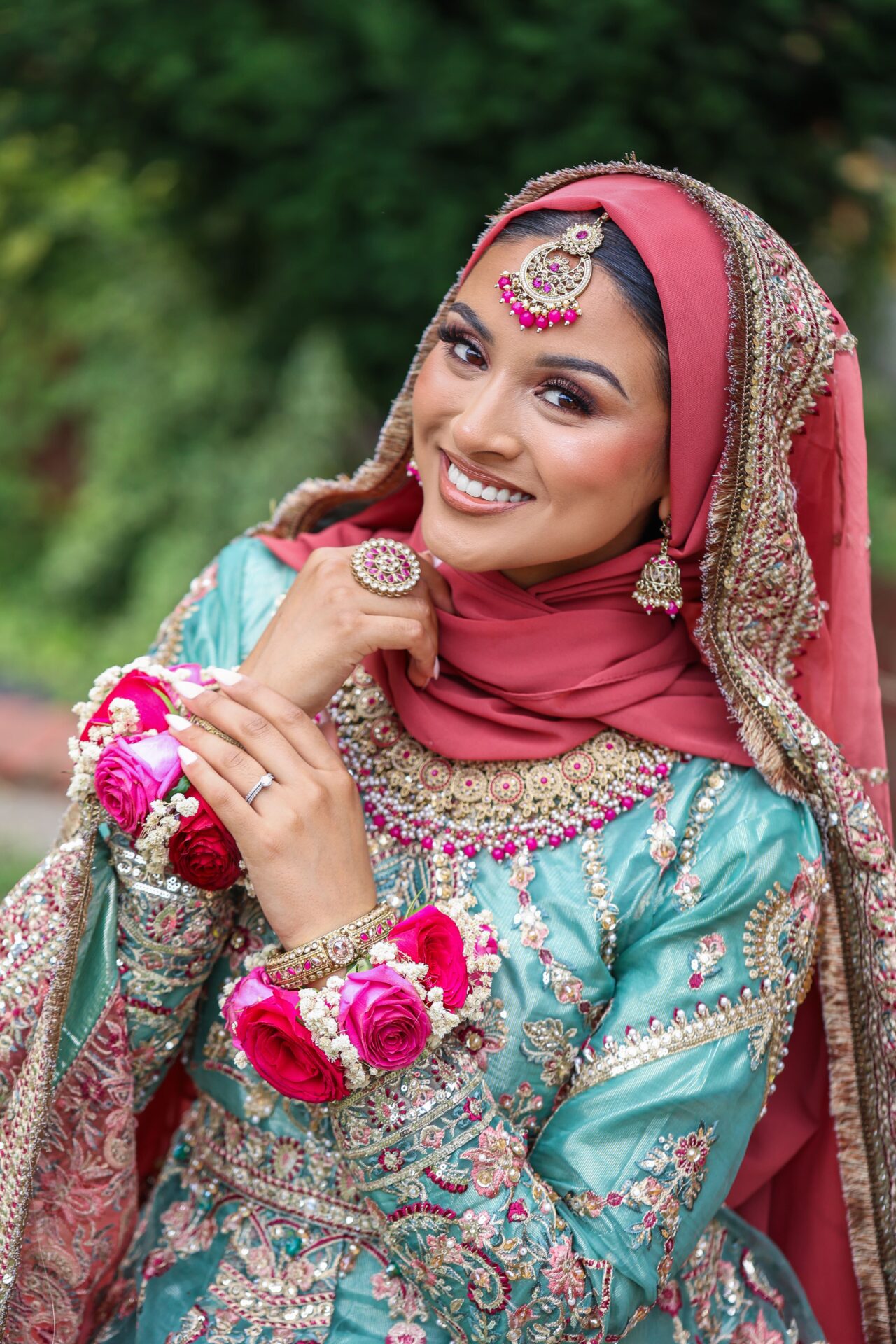 Mehndi bride wearing traditional flower bangles captured in London.