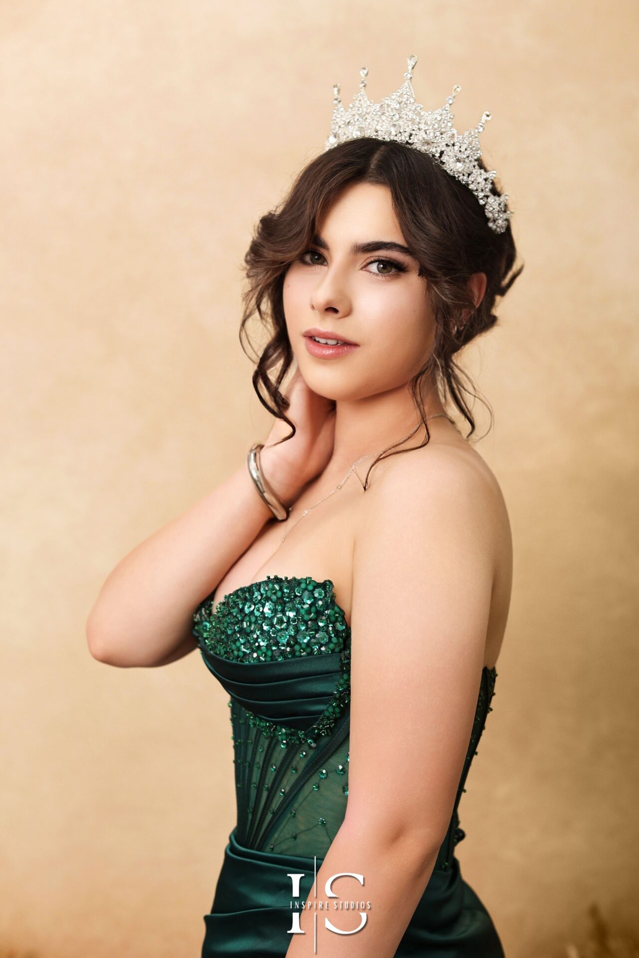 Teen smiling in a prom dress during a professional studio photoshoot