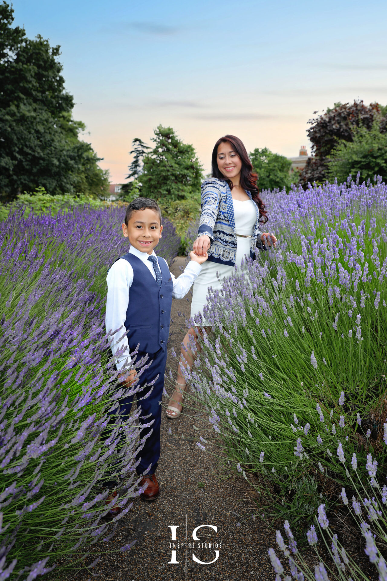 Families enjoying a sunset outdoor photography session in a London park.