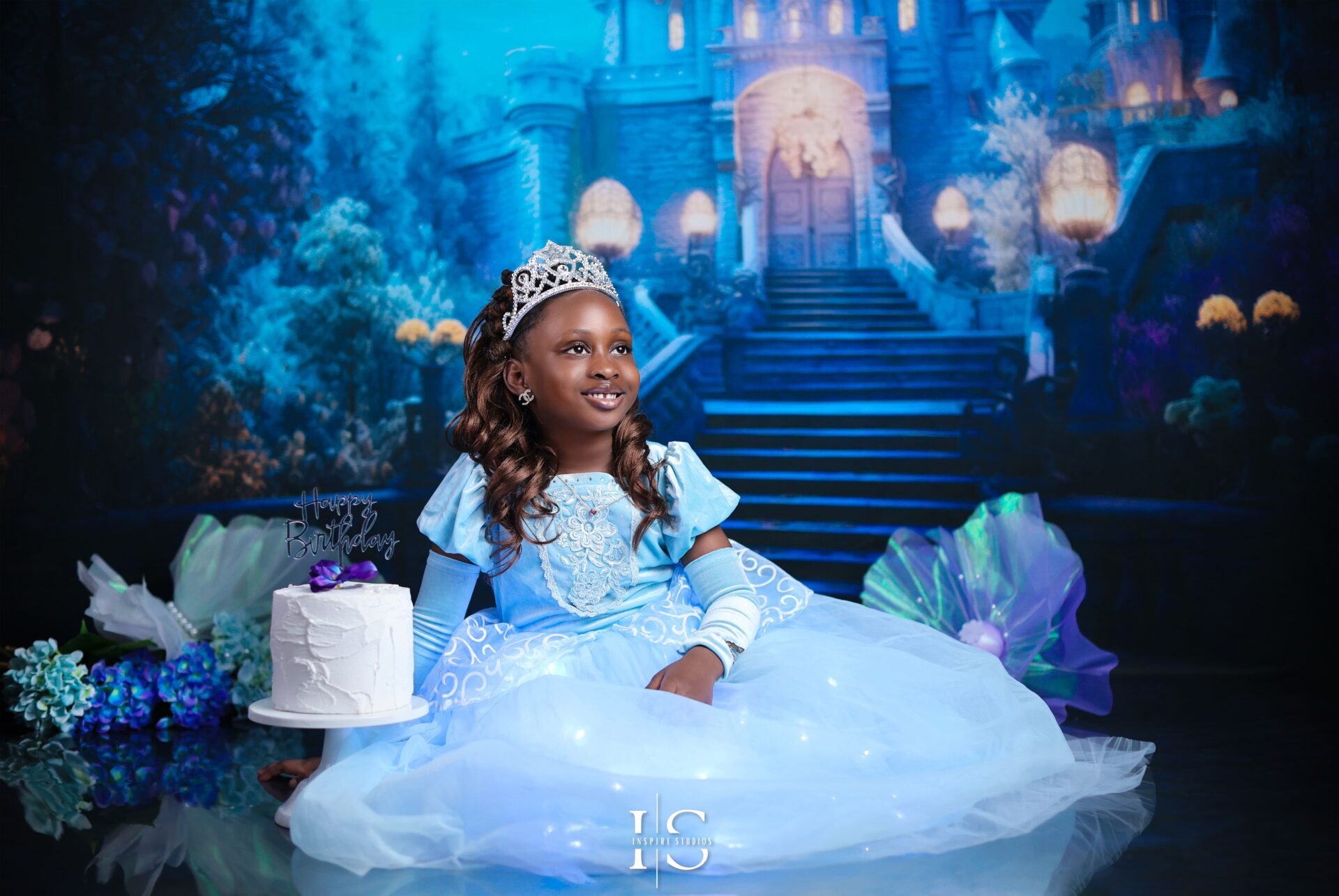 Cinderella-themed children’s studio photoshoot with princess dress and fairytale backdrop