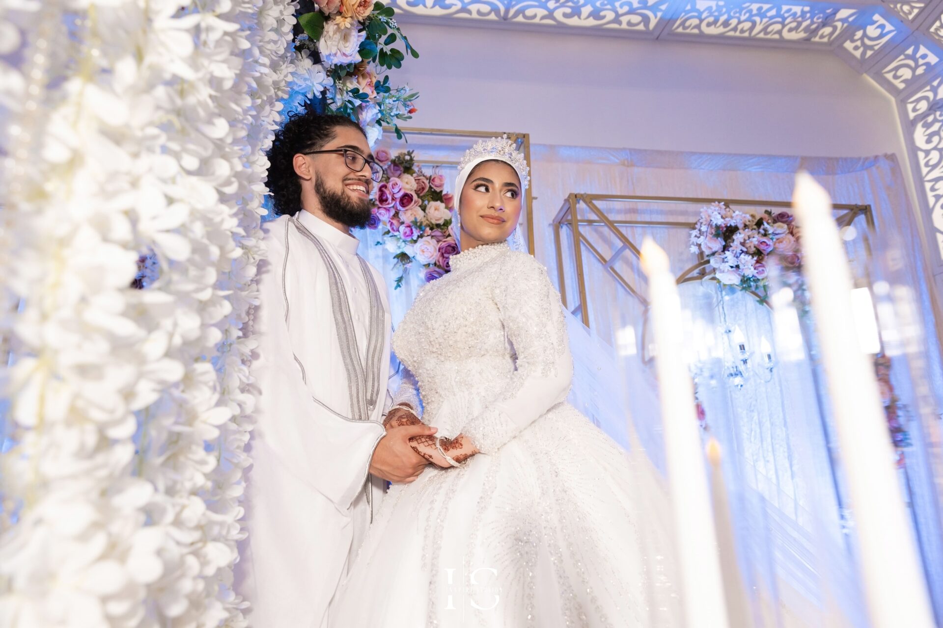Bride and groom portrait on stage at Pavilion Banqueting Walthamstow, London – captured by Inspire Studios