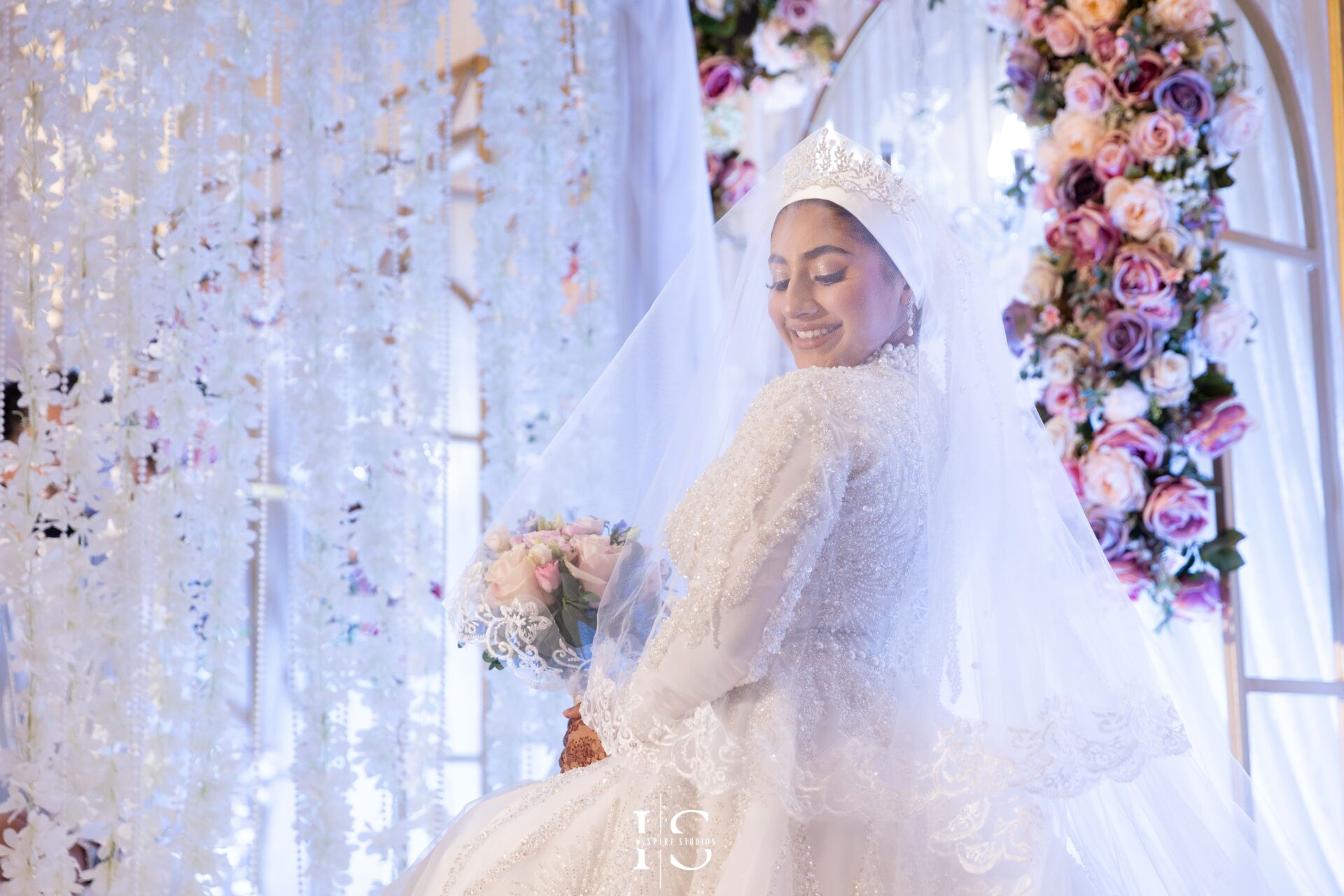 Bride close-up portrait on stage at Pavilion Banqueting Walthamstow, London – captured by Inspire Studios