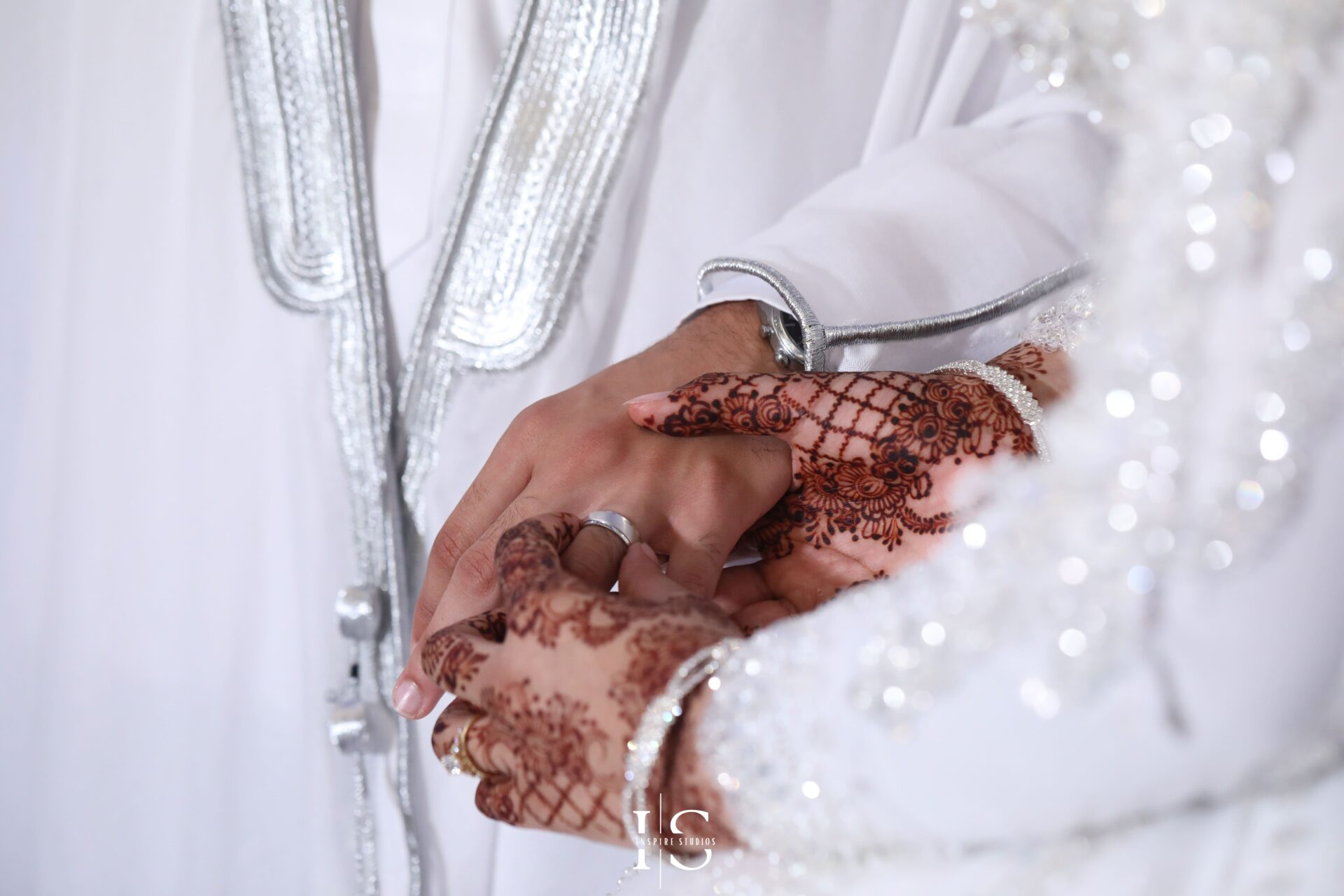 Bride and groom holding hands close-up at Pavilion Banqueting Walthamstow – Inspire Studios