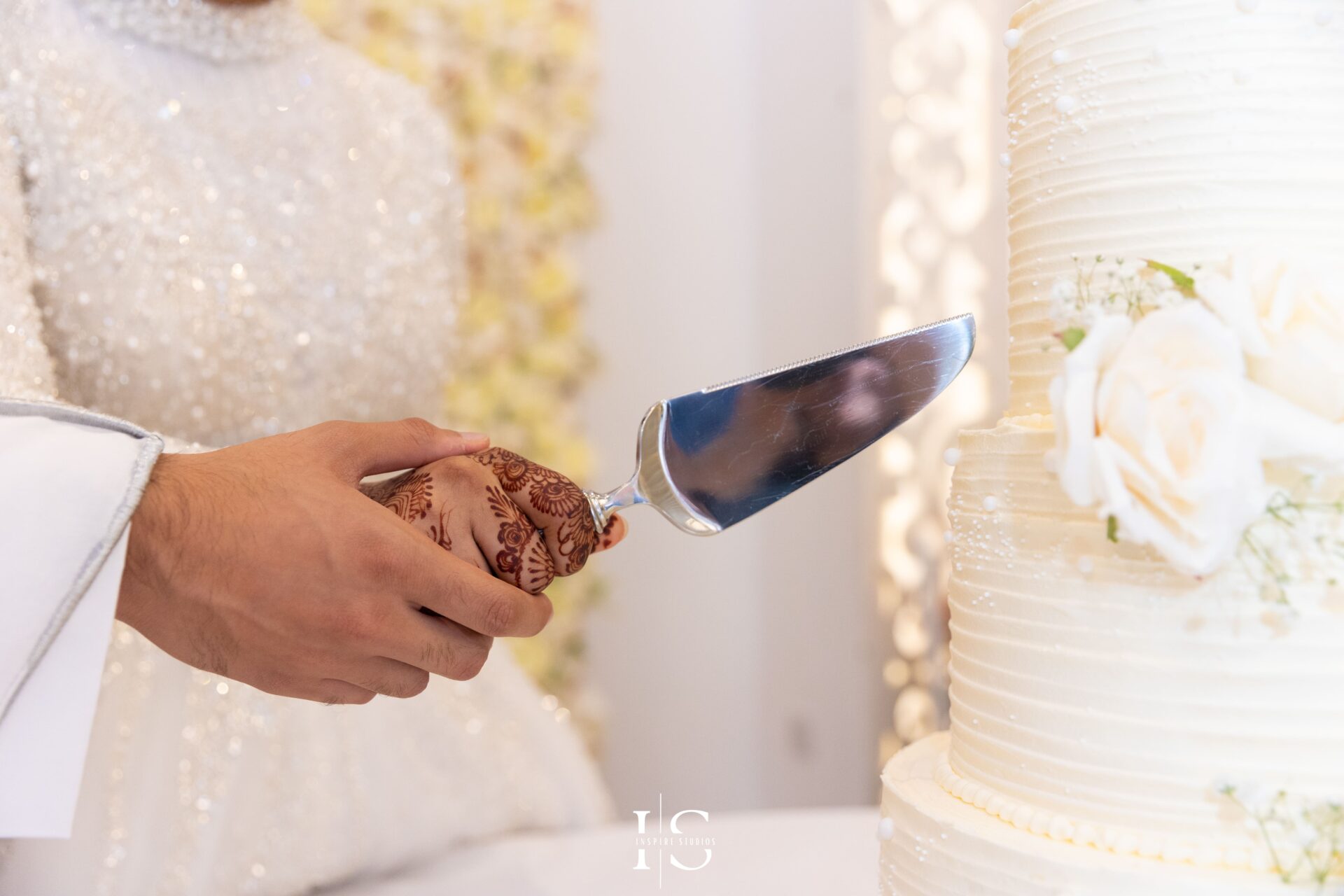 Bride and groom cake cutting during Nikkah wedding at Pavilion Banqueting Walthamstow, London – captured by Inspire Studios