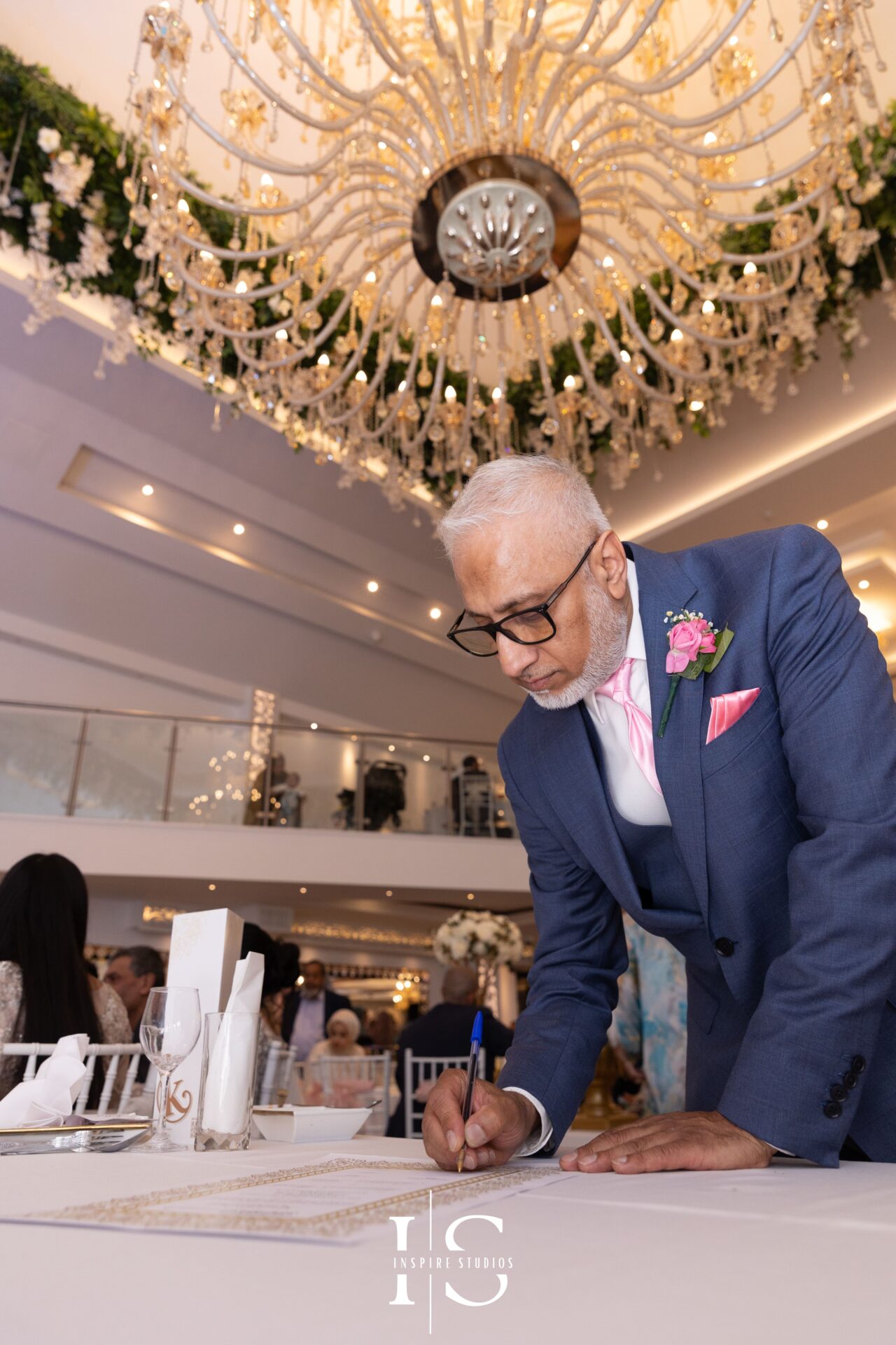 Bride’s father signing Nikkah contract at Pavilion Banqueting Walthamstow – Inspire Studios