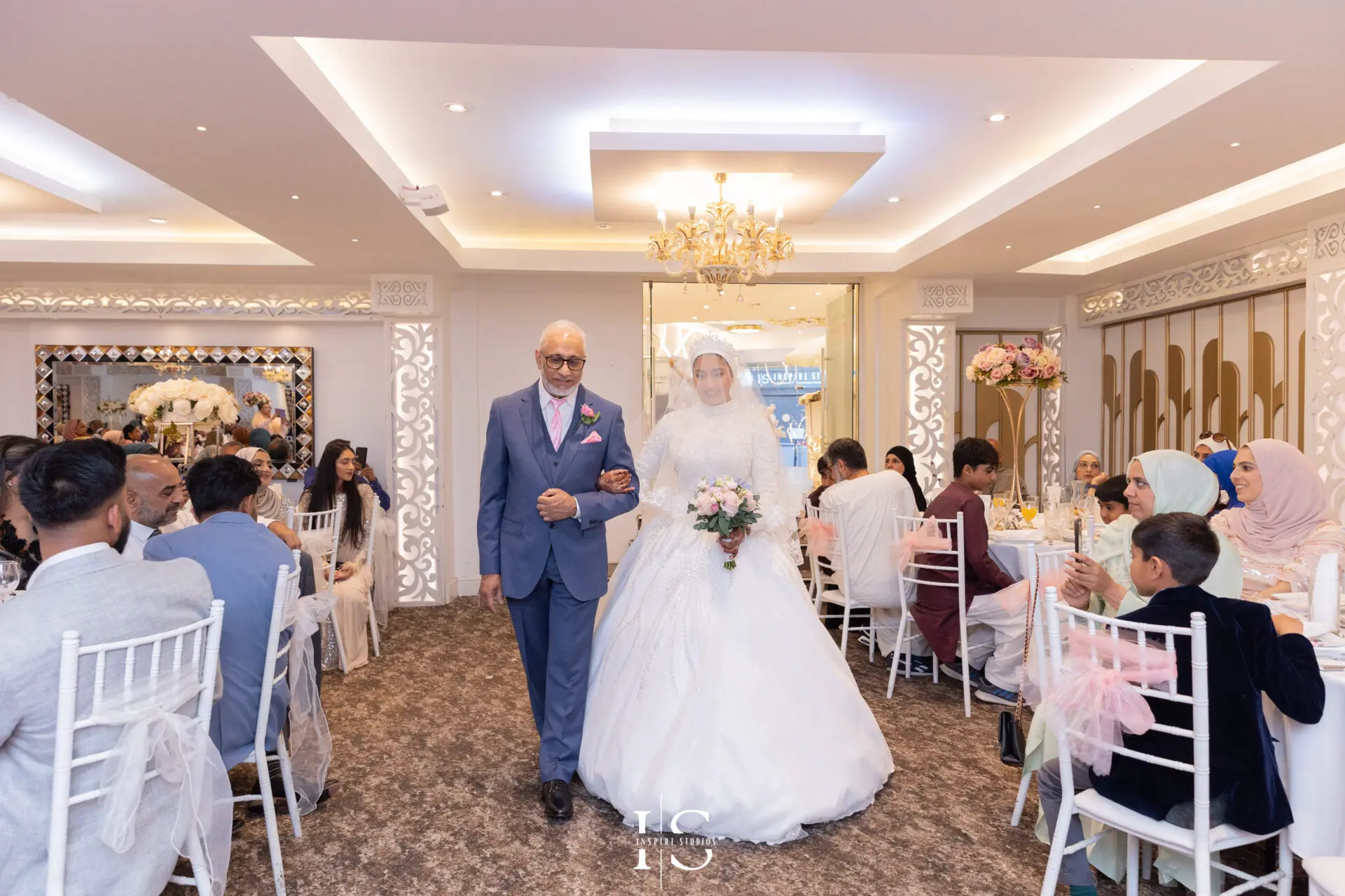 Bride walking into Pavilion Banqueting Walthamstow, London – captured by Inspire Studios