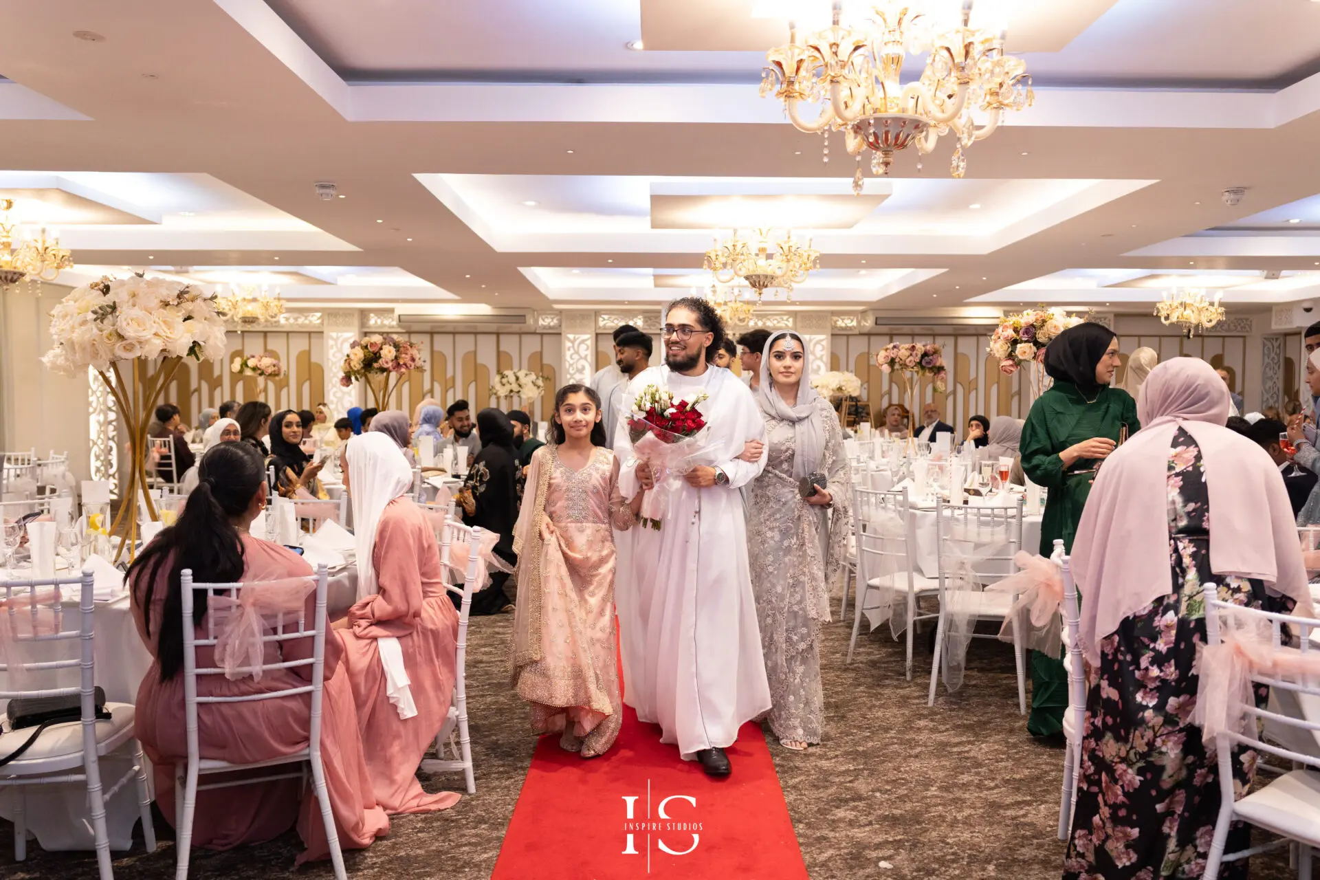 Groom walking into Pavilion Banqueting Walthamstow, London – captured by Inspire Studios