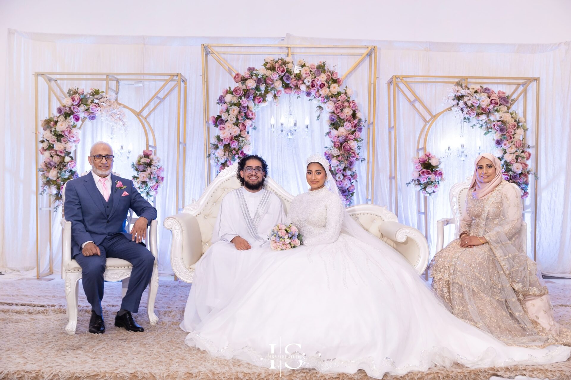 Bride, groom and family on stage at Pavilion Banqueting Walthamstow, London – captured by Inspire Studios