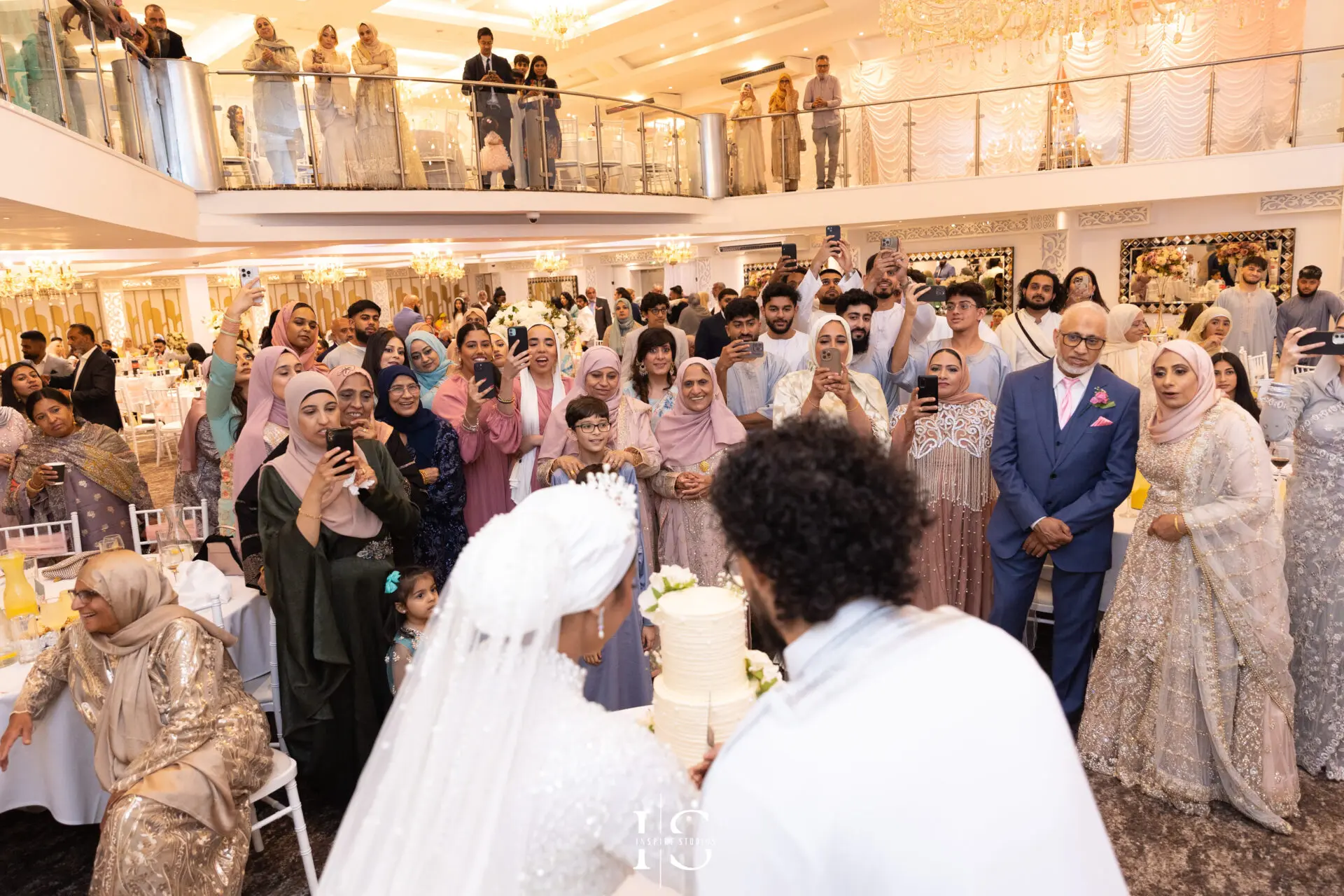Bride, groom and guests candid photo at Pavilion Banqueting Walthamstow, London – captured by Inspire Studios