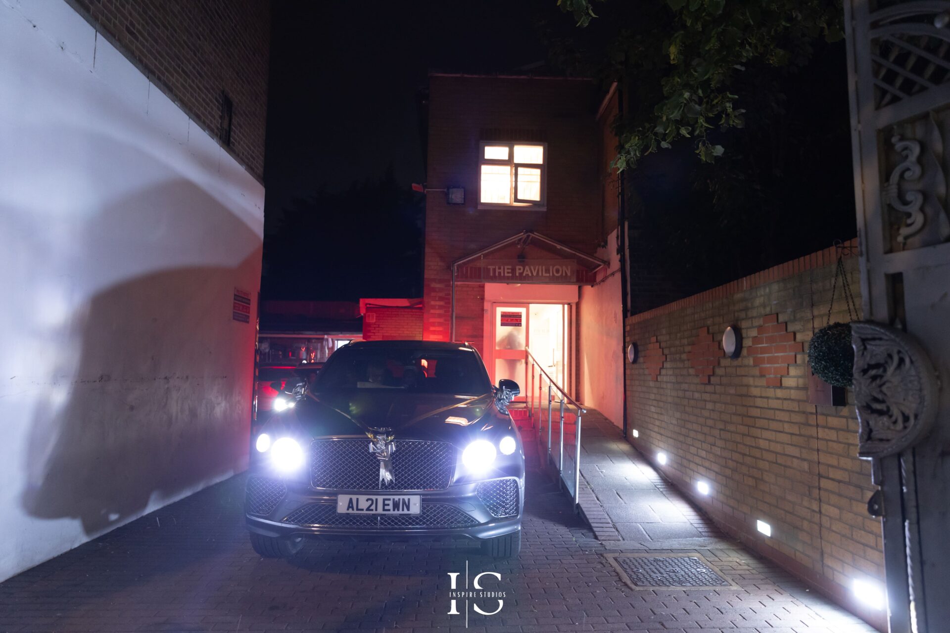 Bride and groom leaving Pavilion Banqueting Walthamstow in car – captured by Inspire Studios