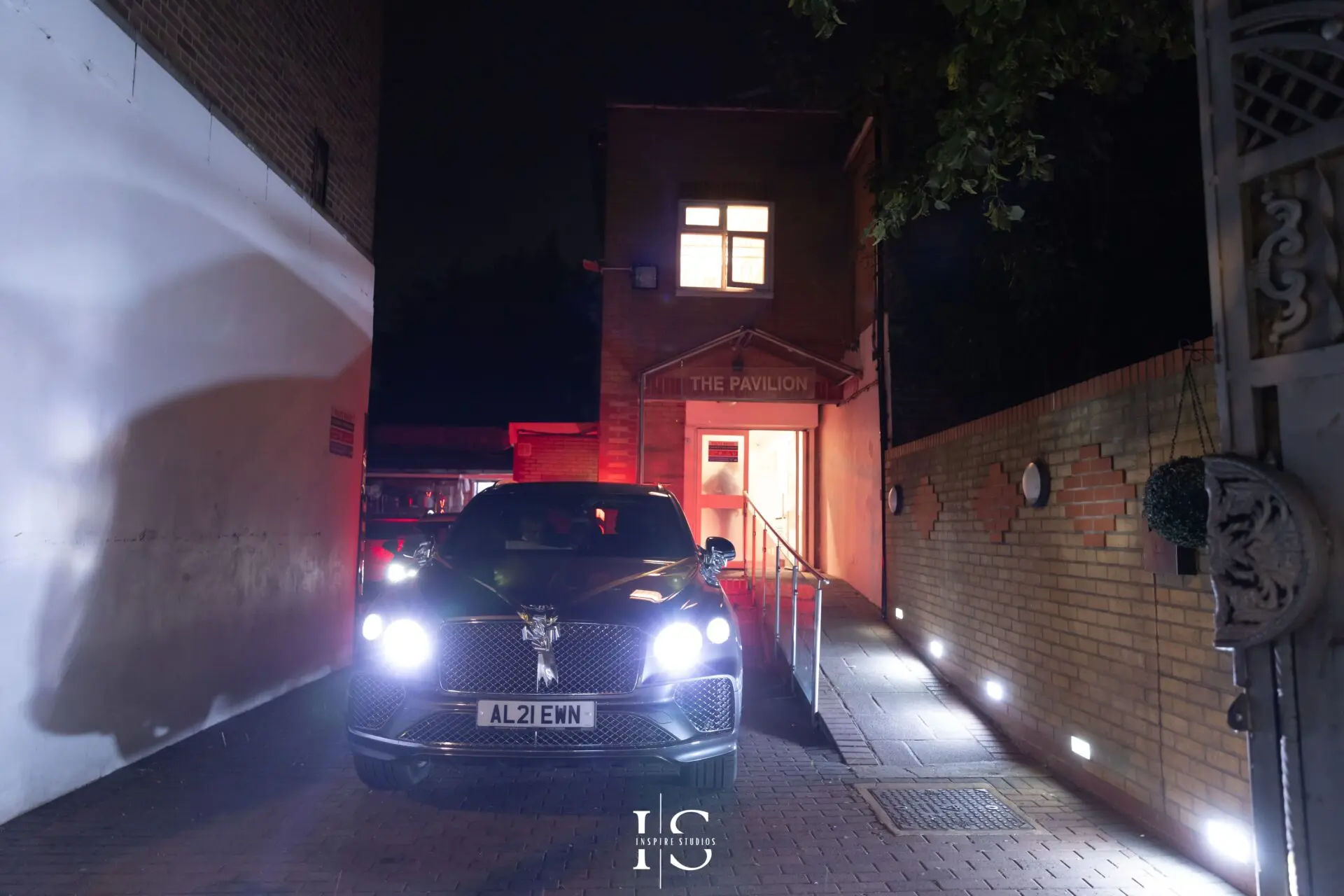 Bride and groom leaving Pavilion Banqueting Walthamstow in car – captured by Inspire Studios
