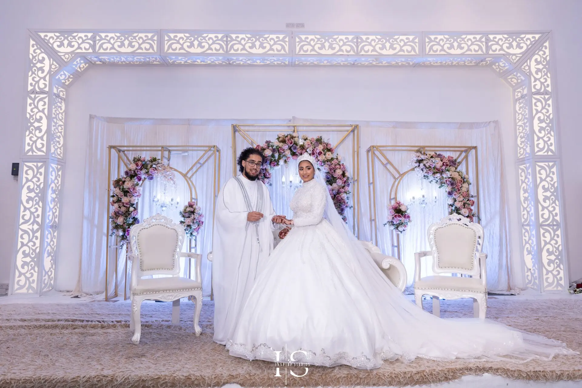 Bride and groom on stage before ring exchange at Pavilion Banqueting Walthamstow, London – captured by Inspire Studios