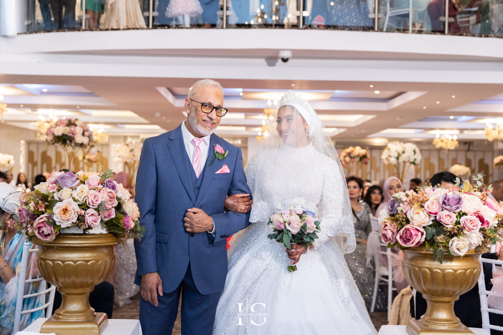 Bride and her father walking into Pavilion Banqueting Walthamstow, London – captured by Inspire Studios