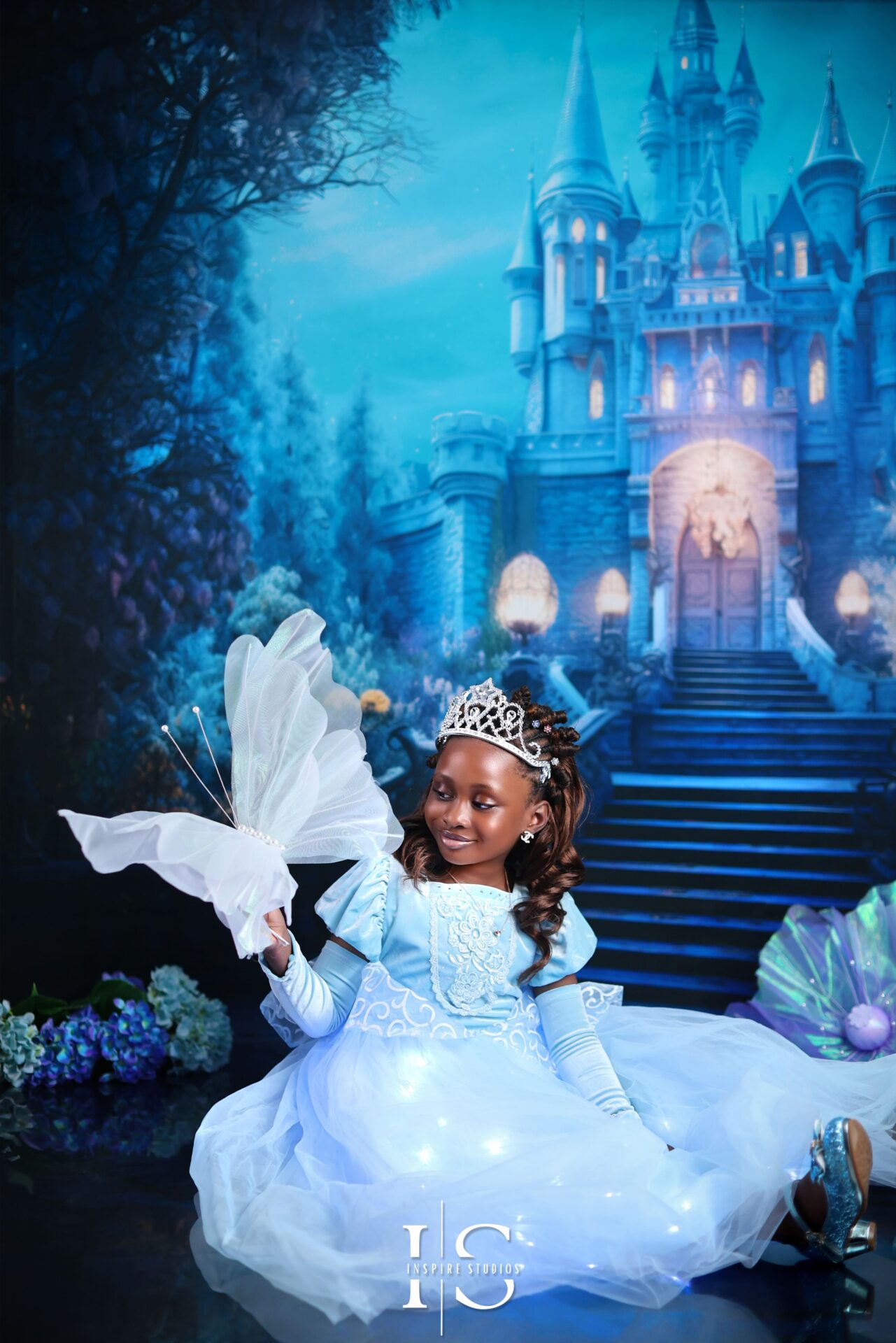 London children’s Cinderella photoshoot with blue gown and castle backdrop