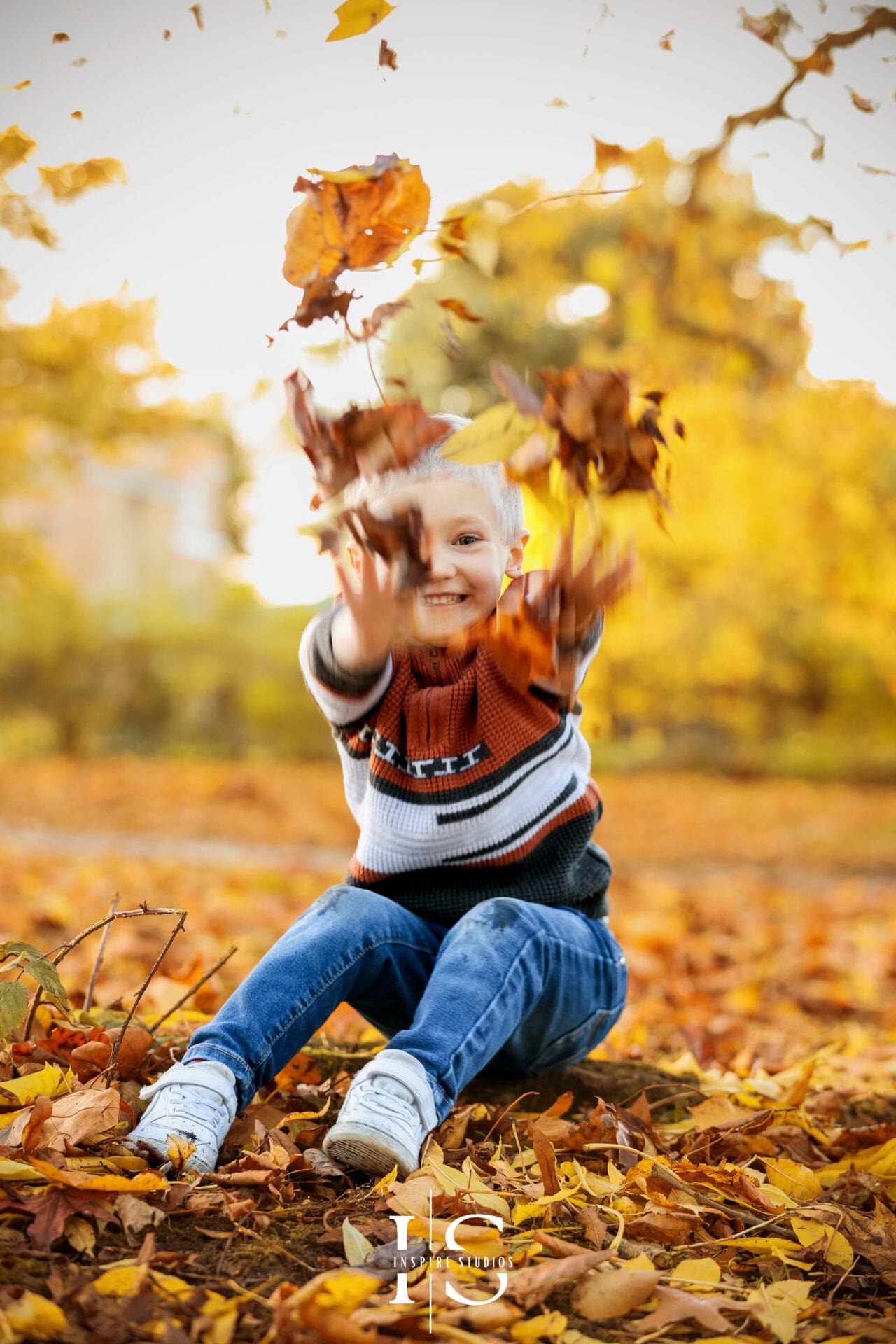 Autumn outdoor photoshoot portraits with warm fall colours and natural candid expressions.
