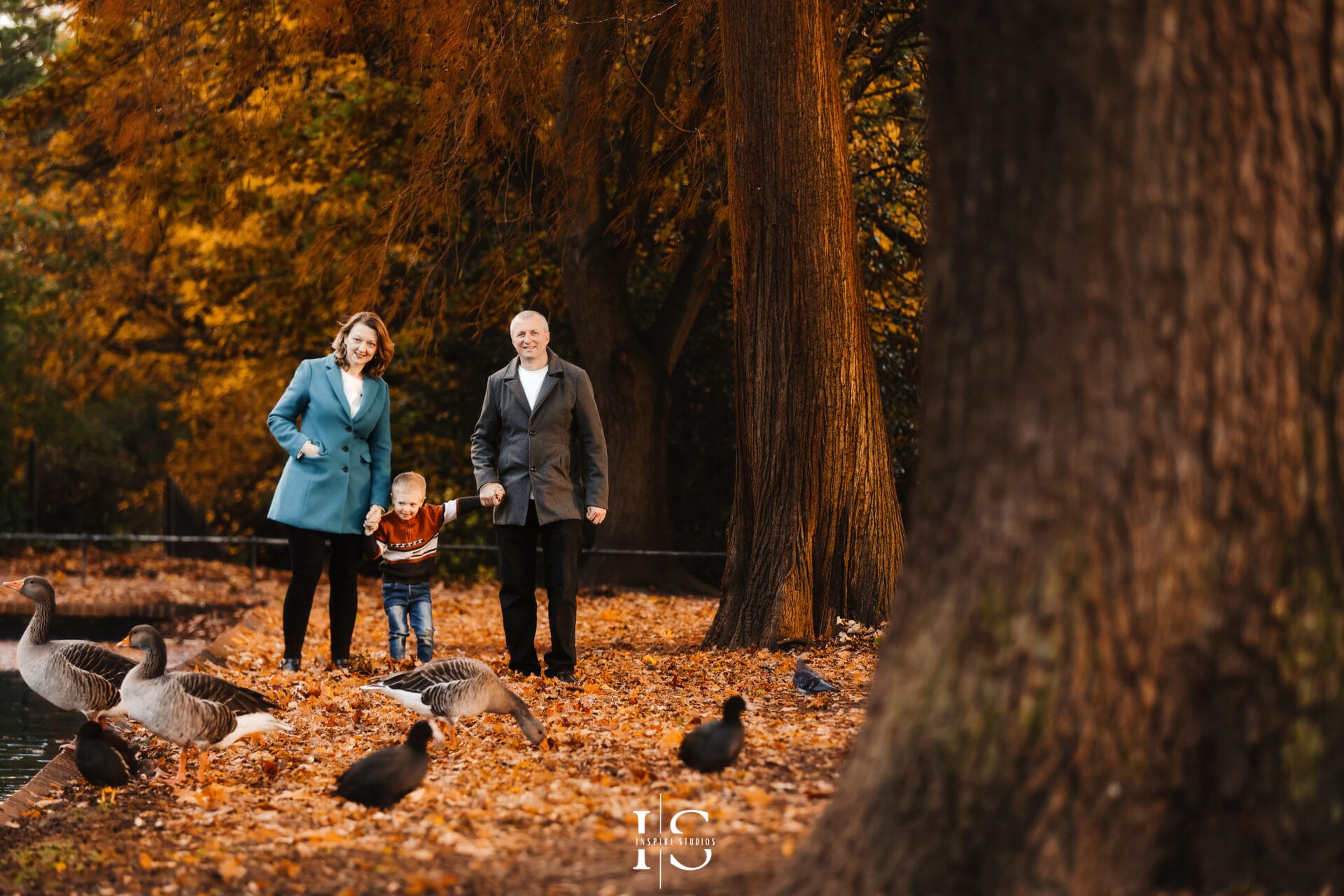 Autumn photoshoot in Valentines Park with vibrant fall foliage and natural outdoor portrait lighting.