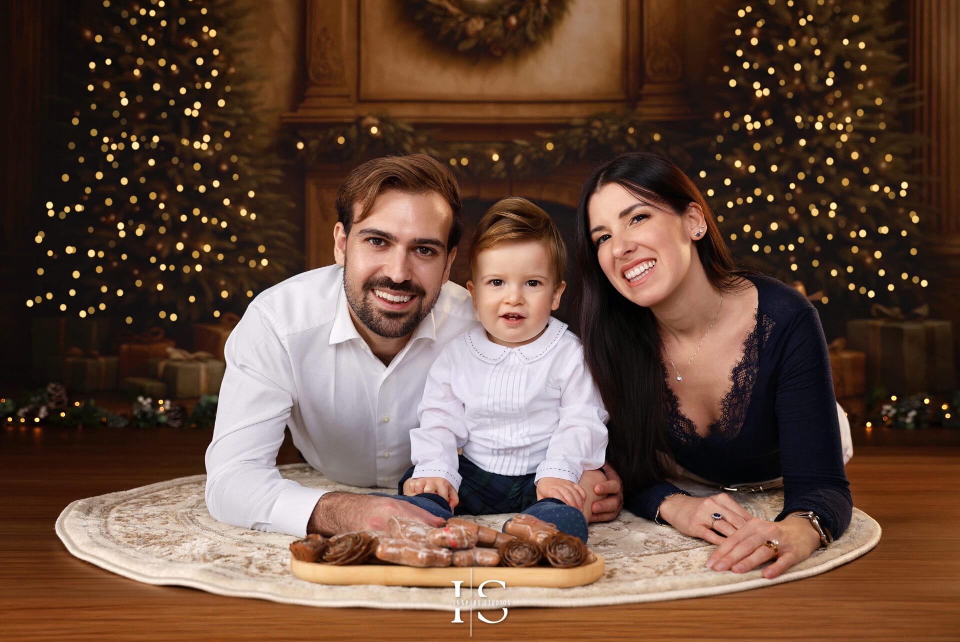 2025 Christmas family photoshoot in London with a vintage festive backdrop and warm seasonal styling.