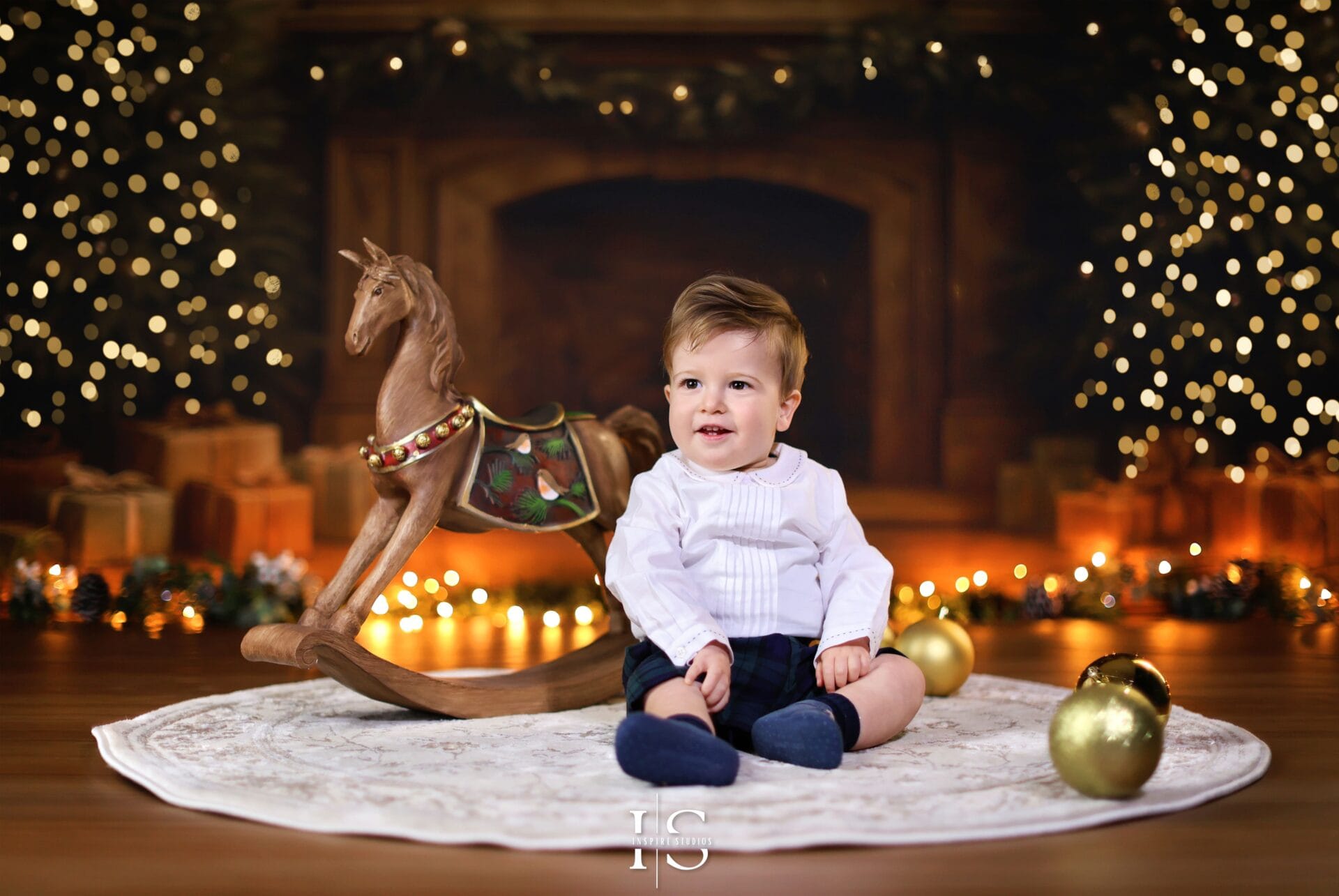 Christmas photoshoot in London with a vintage holiday backdrop featuring festive décor and warm studio lighting.
