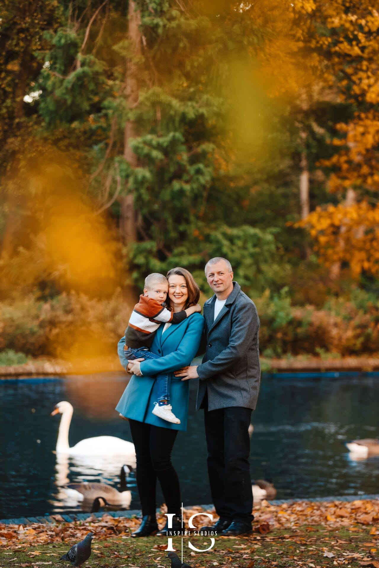 Outdoor autumn family photos in Valentines Park Ilford with golden leaves and natural candid moments.