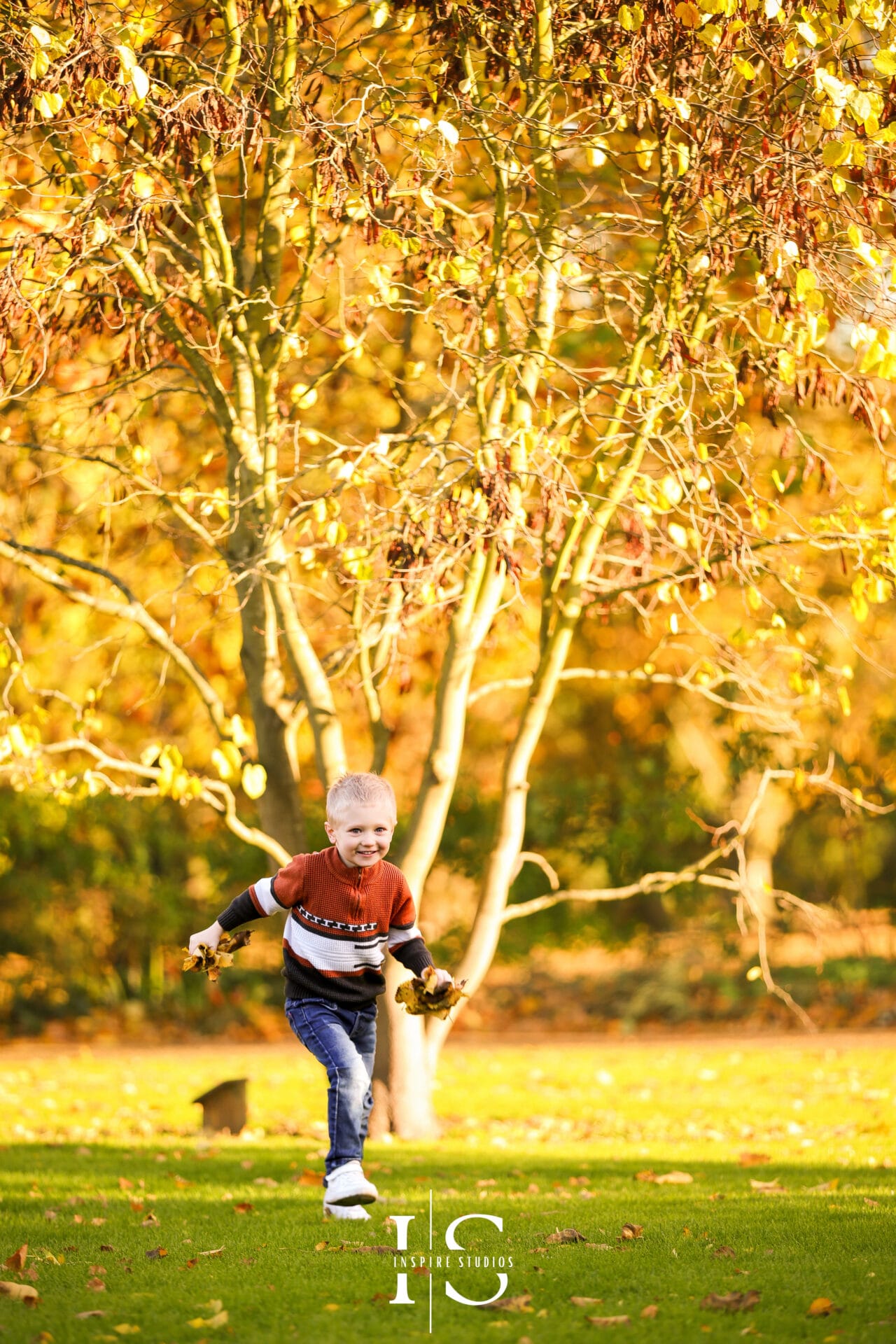 Autumn family session in Valentines Park with vibrant fall colours and candid outdoor moments.