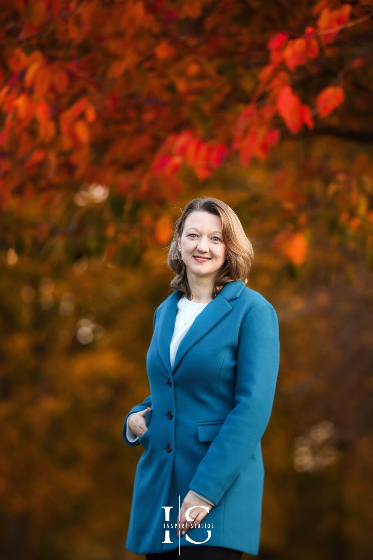 Autumn outdoor photoshoot in Valentines Park with warm seasonal colours and natural portrait lighting.
