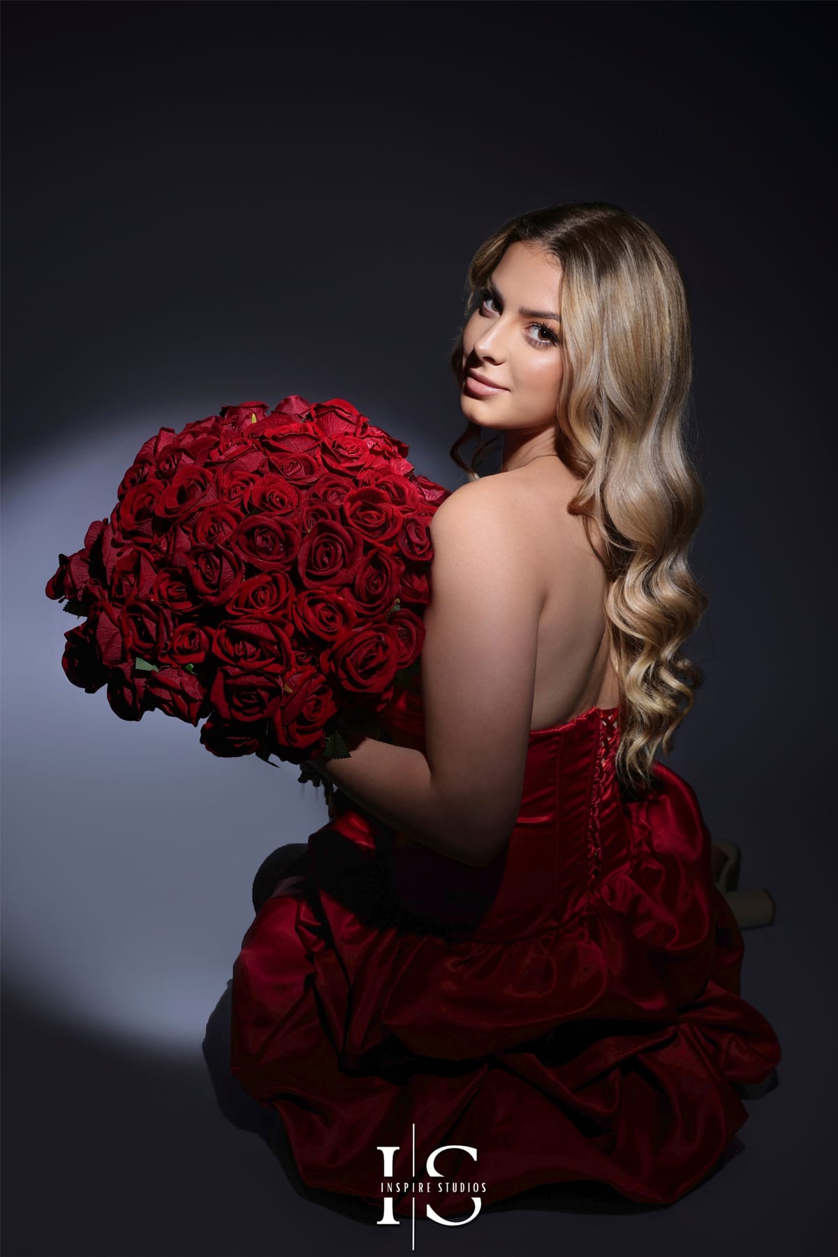 Stylish 20th birthday spotlight photoshoot in studio with dramatic lighting