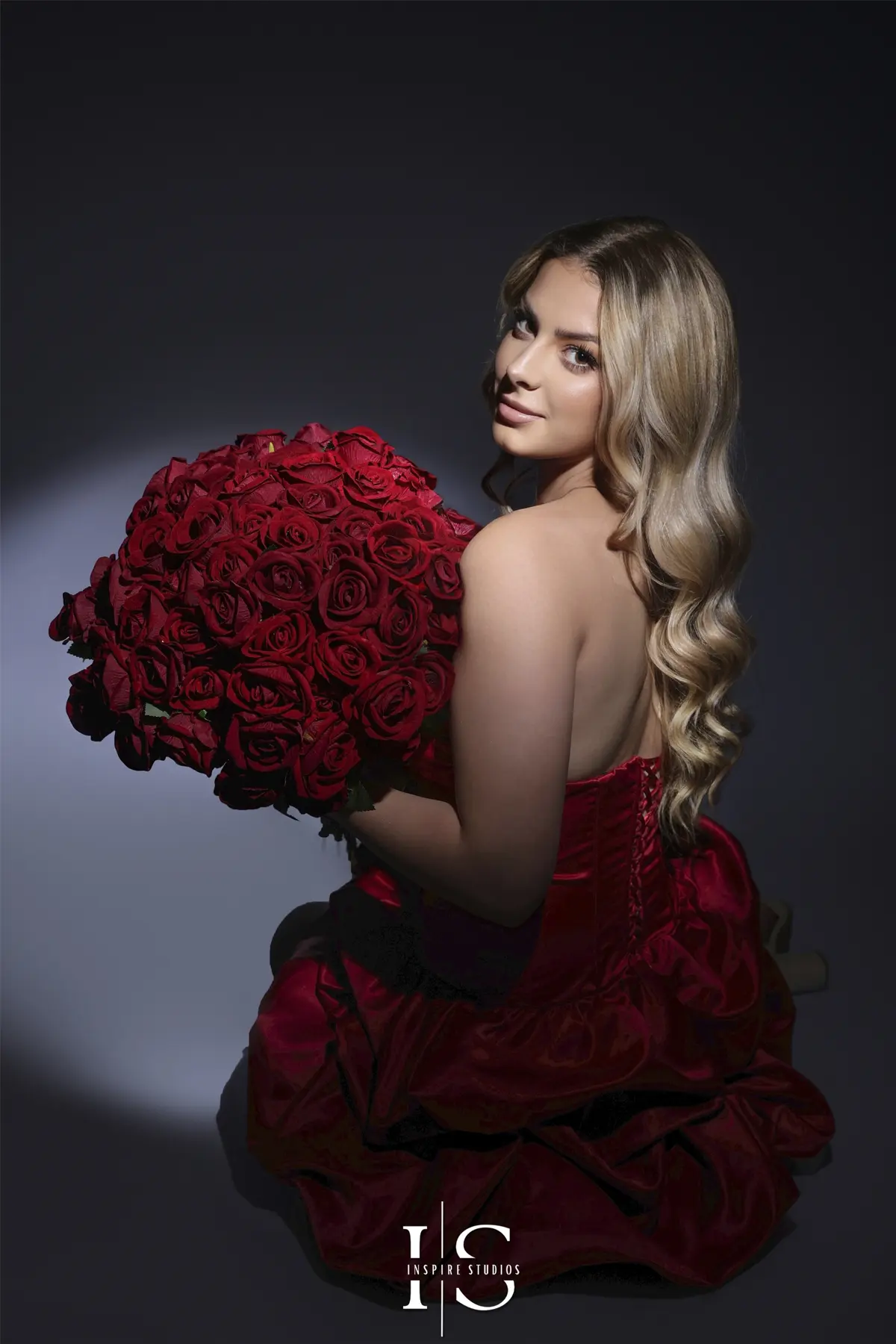 Stylish 20th birthday spotlight photoshoot in studio with dramatic lighting