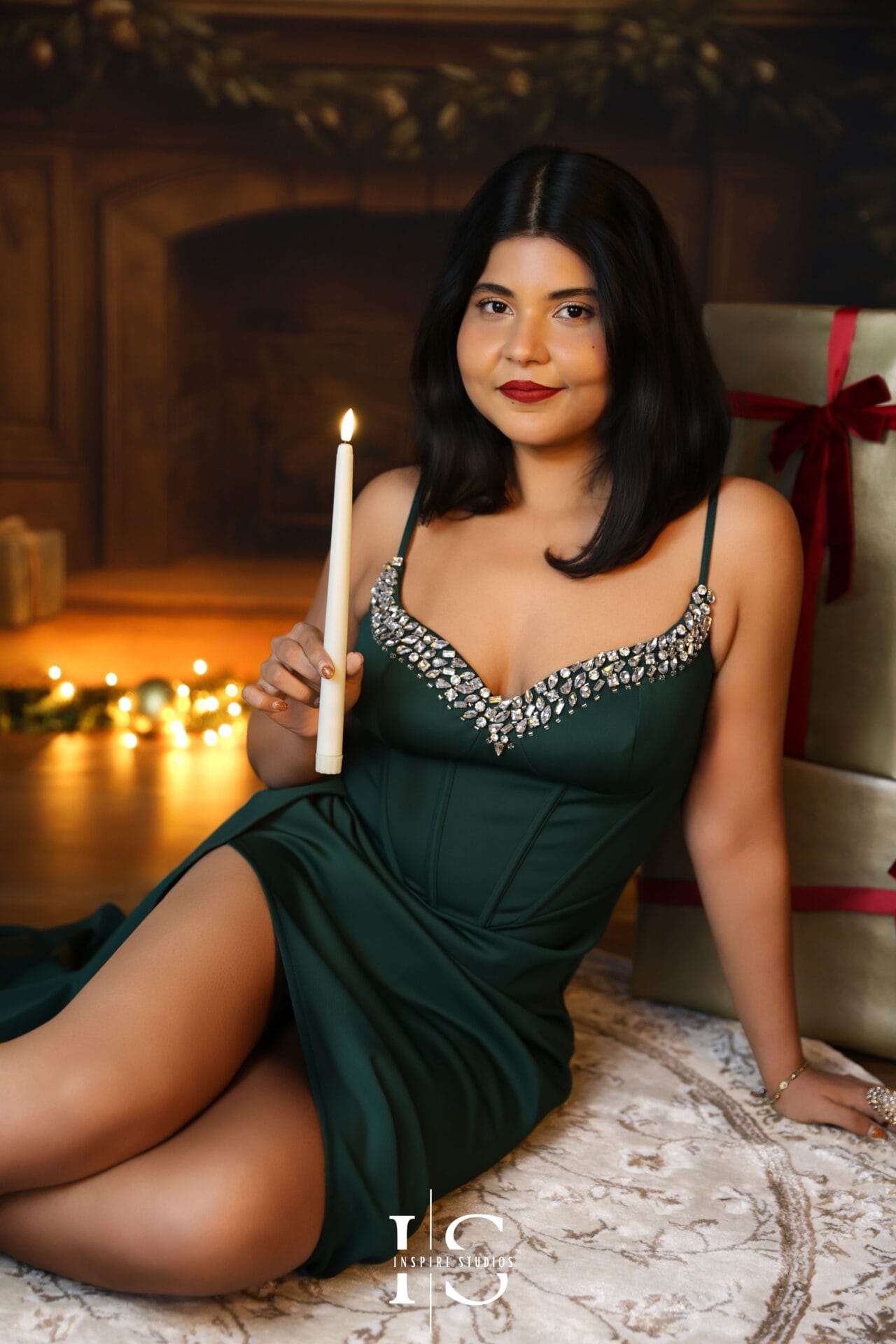 Boho-style Christmas portrait of a woman in a London studio with neutral holiday décor.